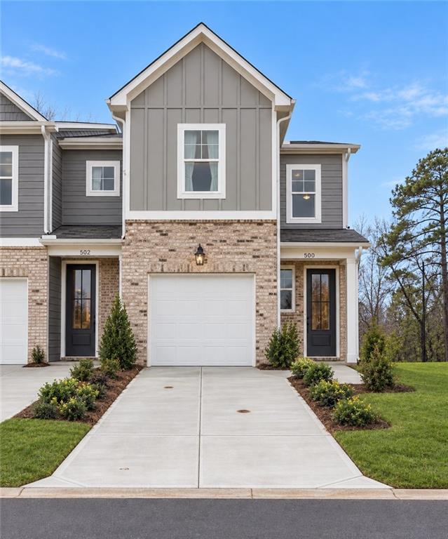 Front exterior of Davidson Homes' The Wilmington A floor plan with 1-car garage in Stegall Village, Emerson, Georgia