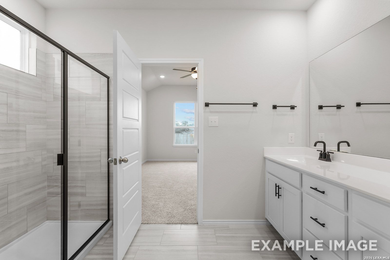 Modern bathroom with walk-in shower and white vanity in The Sequoia C floor plan by Davidson Homes, San Antonio, Texas.