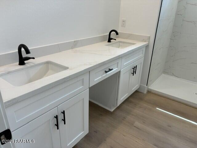 Double vanity bathroom with white cabinetry, quartz countertops, and matte black faucets in Davidson Homes Durango II G, Prescott AZ