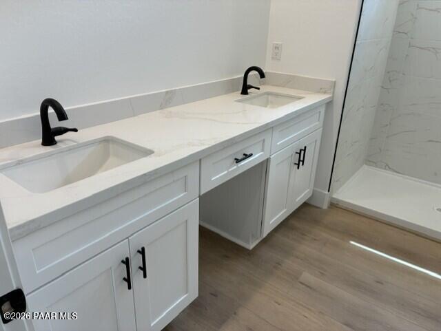 Double vanity bathroom with white cabinetry, quartz countertops, and matte black faucets in Davidson Homes Durango II G, Prescott AZ