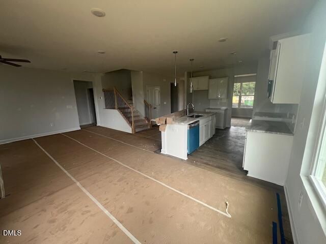 Open-concept kitchen and living area in The Ash B floor plan at Retreat at North Main, Lillington, North Carolina.