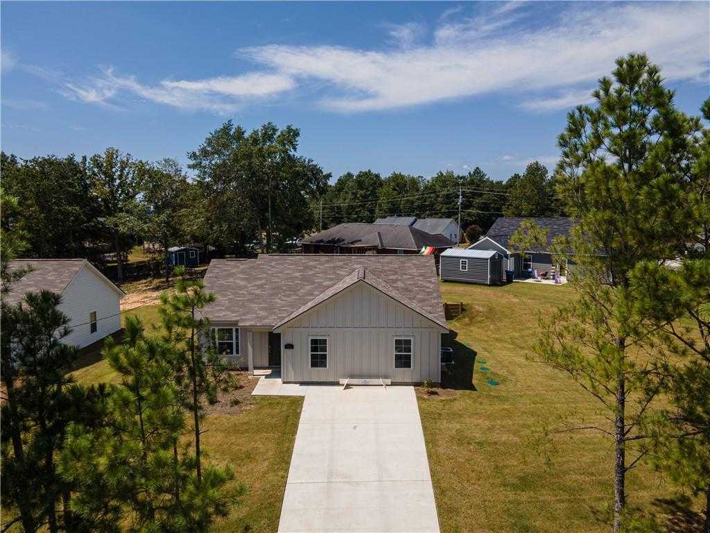 Aerial view of The Washington 3-bedroom single-story home by Evermore Homes in Heatherbrook, Phenix City, Alabama, with driveway and pine-shaded yard