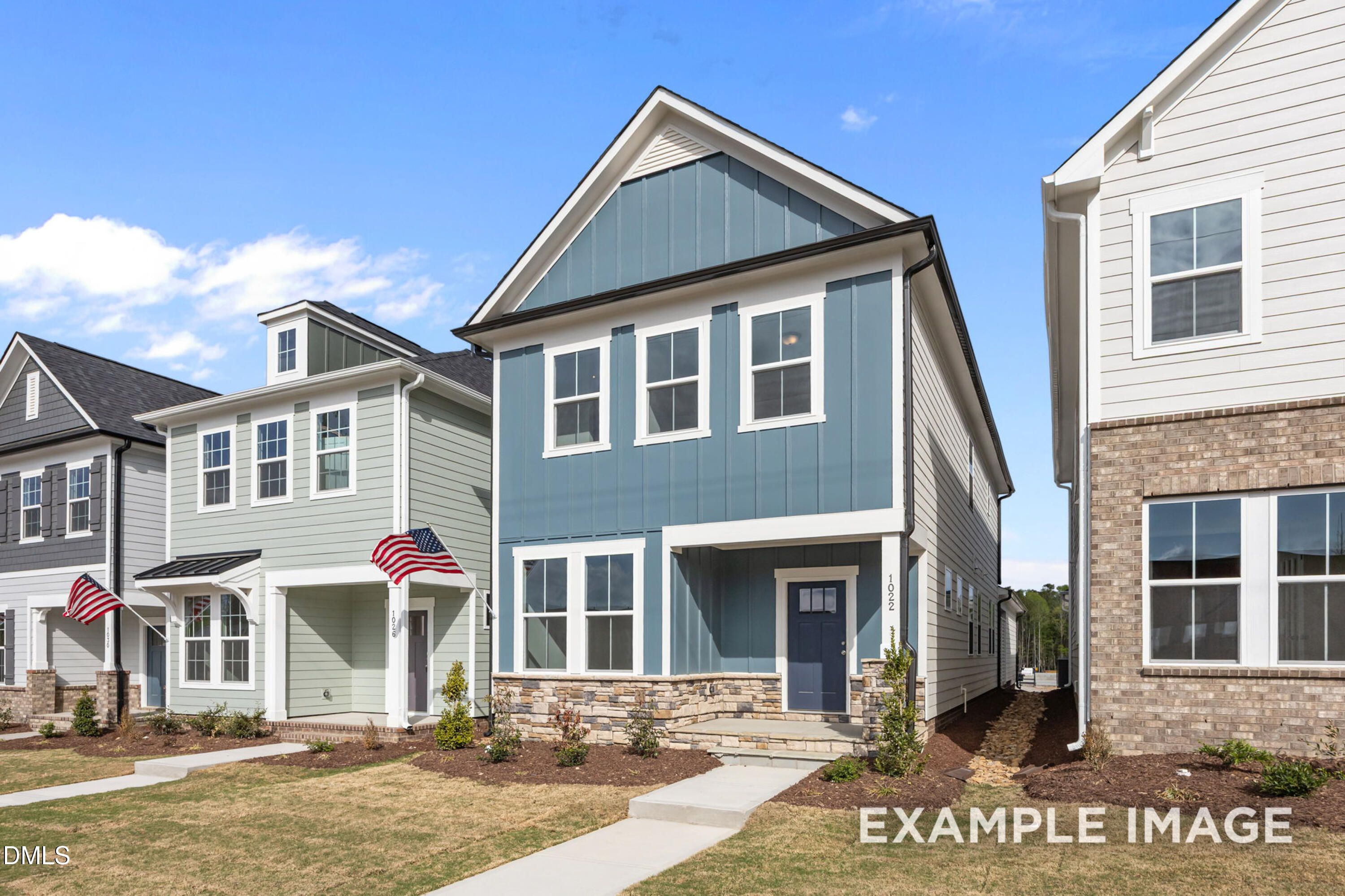 Two-story Alexander B floor plan by Davidson Homes with stone accents in Forestville Yard, Knightdale, NC.