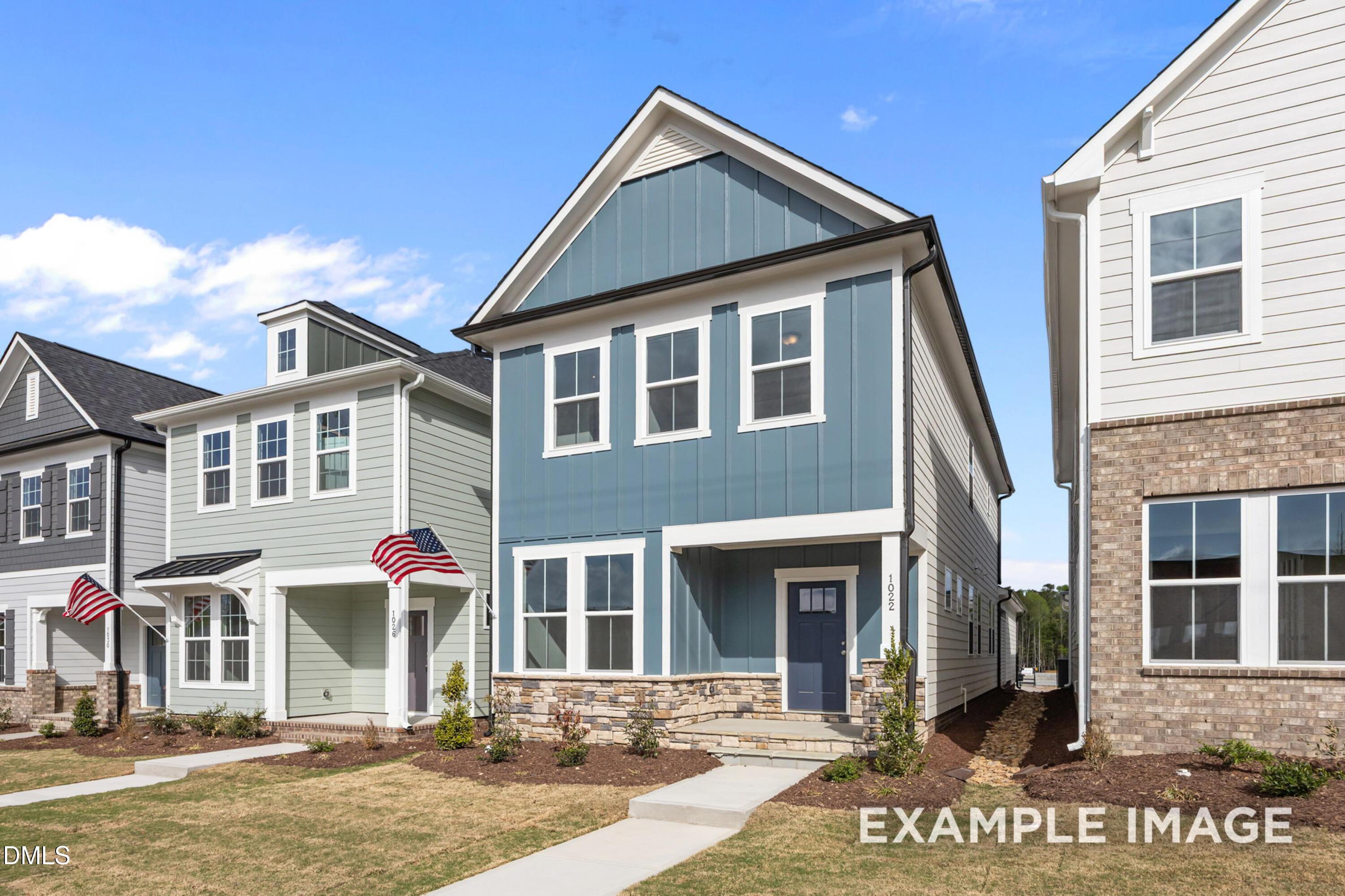 Two-story Alexander B floor plan by Davidson Homes with stone accents in Forestville Yard, Knightdale, NC.