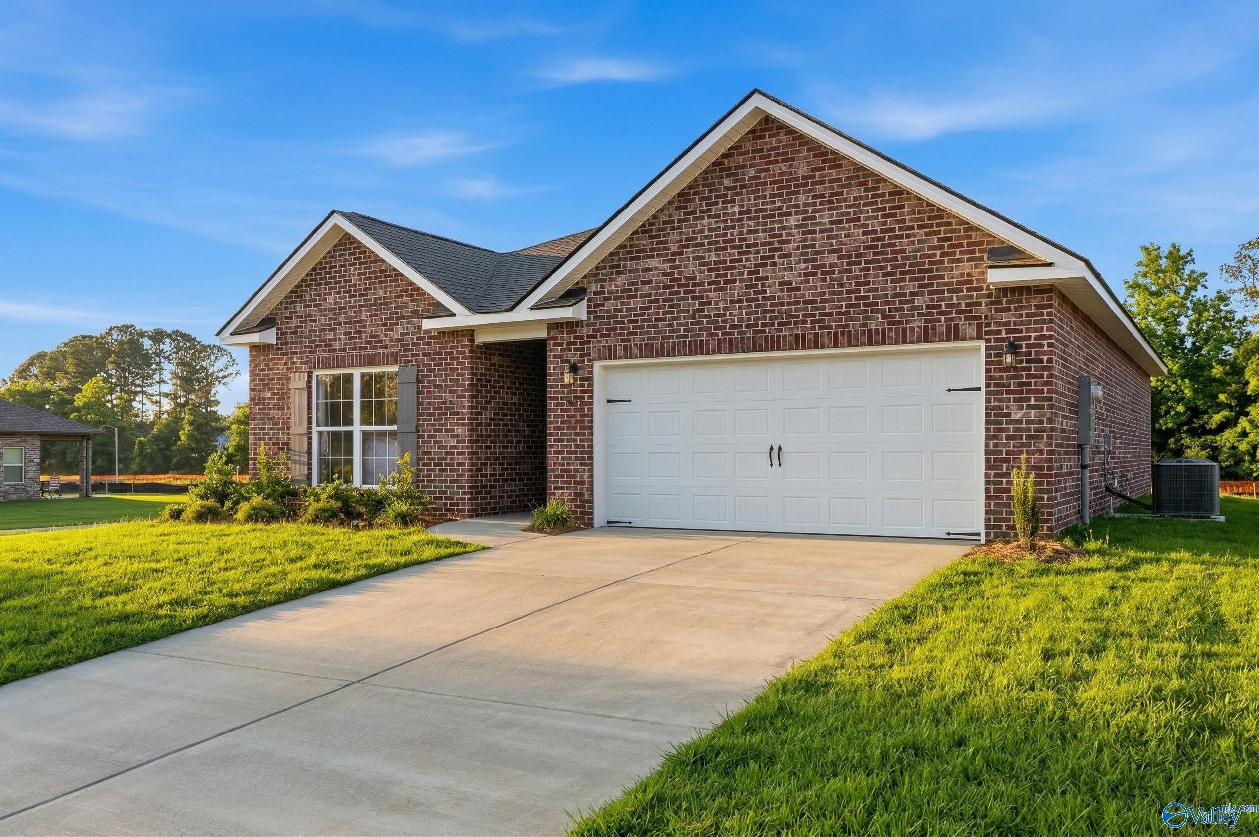 Single-story brick home with 2-car garage, The Asheville C floor plan by Davidson Homes in Spragins Cove, Huntsville, AL.