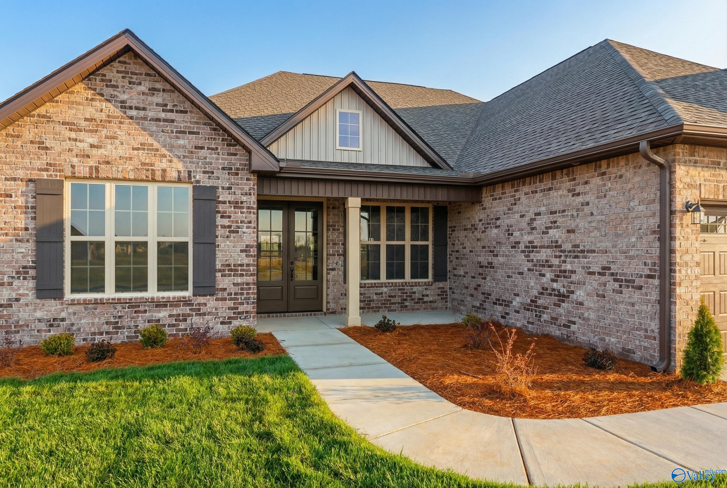 Charming single-story brick home with gabled roof, covered entry, and landscaped front yard in Briercreek, Meridianville, Alabama