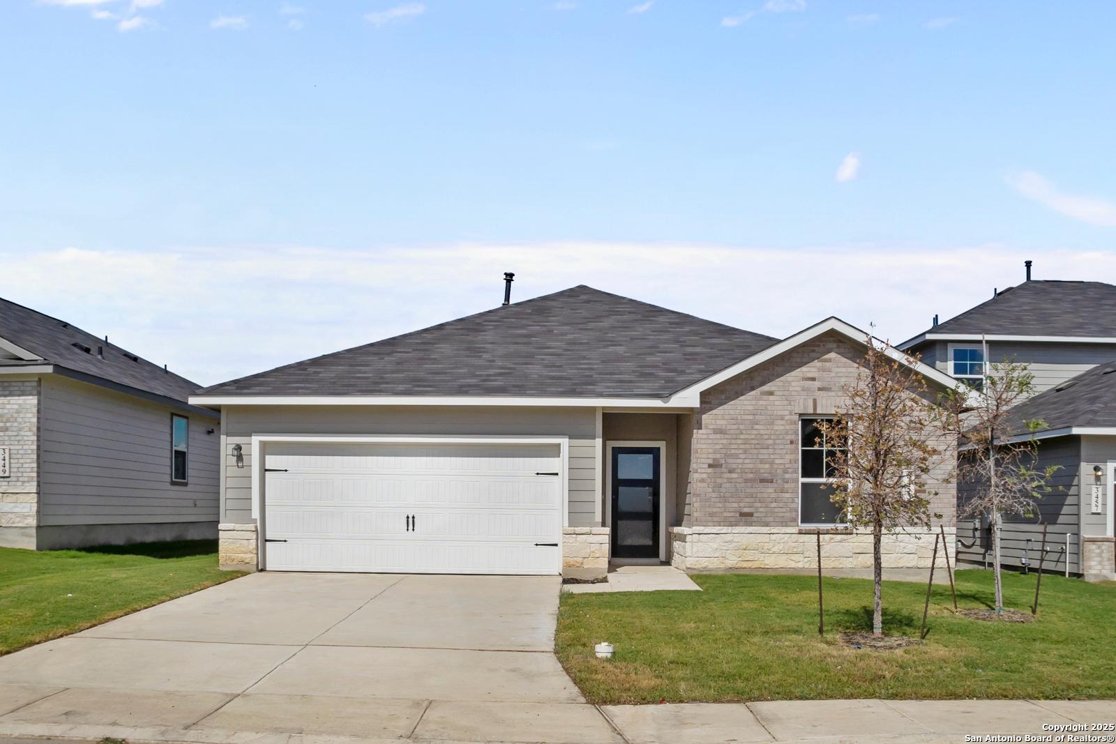 Modern brick-accented single-story home with 2-car garage and driveway in Horizon Pointe, Converse, Texas - Davidson Homes The Asheville H