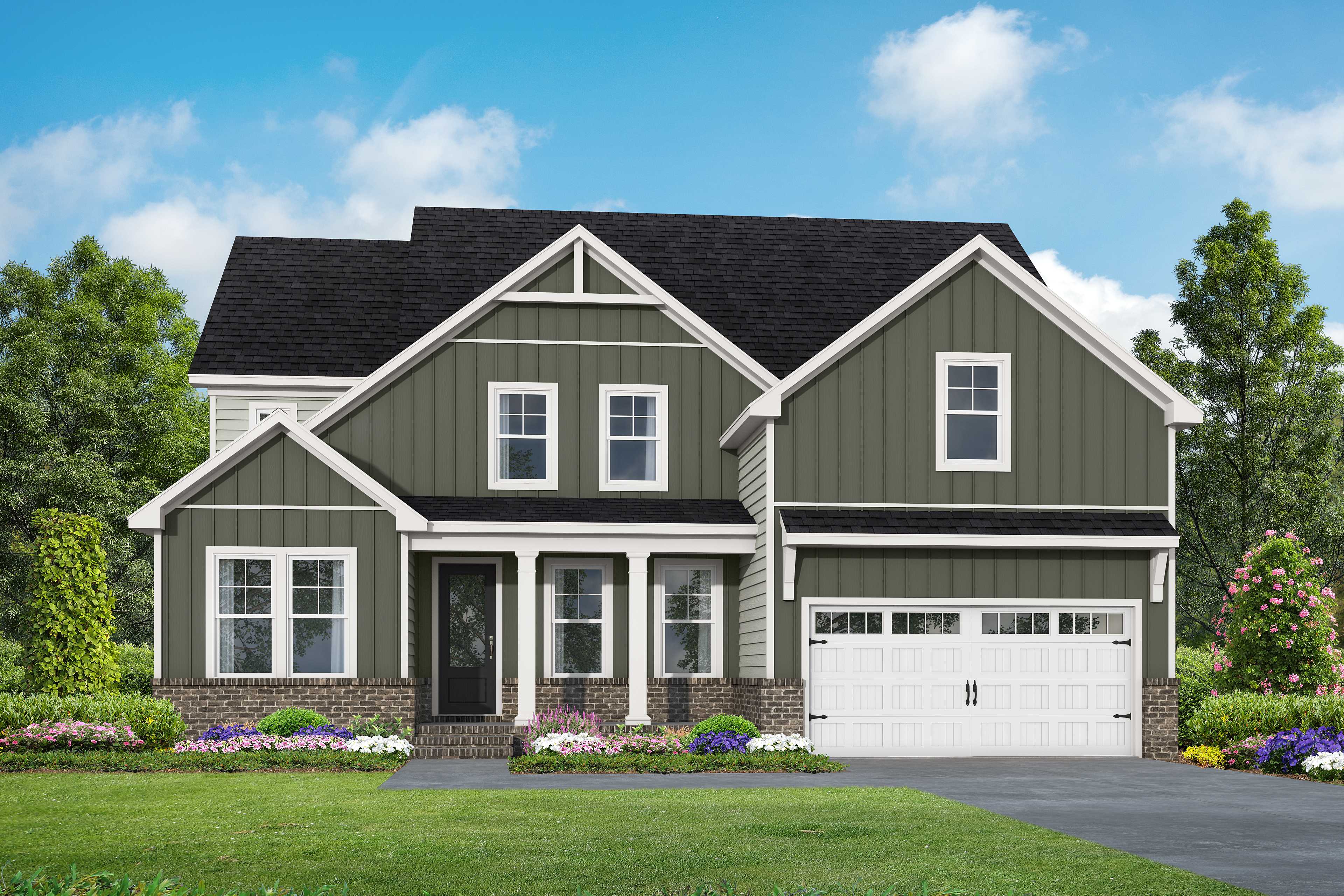 Two-story Crawford C elevation by Davidson Homes: green siding, white trim, gabled roof, covered porch, two-car garage, Raleigh NC landscaping