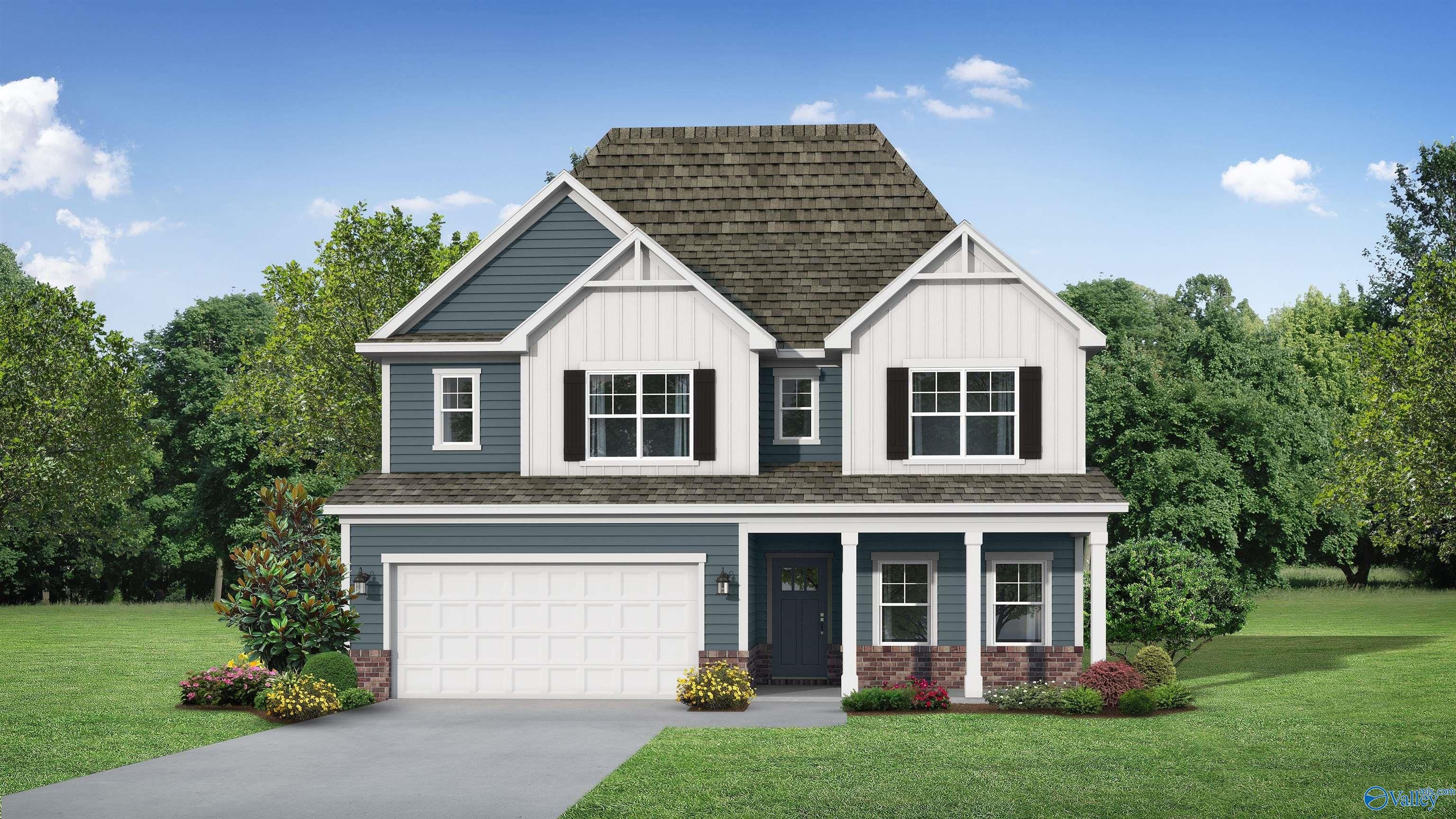 Two-story Davidson Homes Shelby D exterior in blue with white trim, two-car garage, and front porch in Anderson Farm, Athens, Alabama