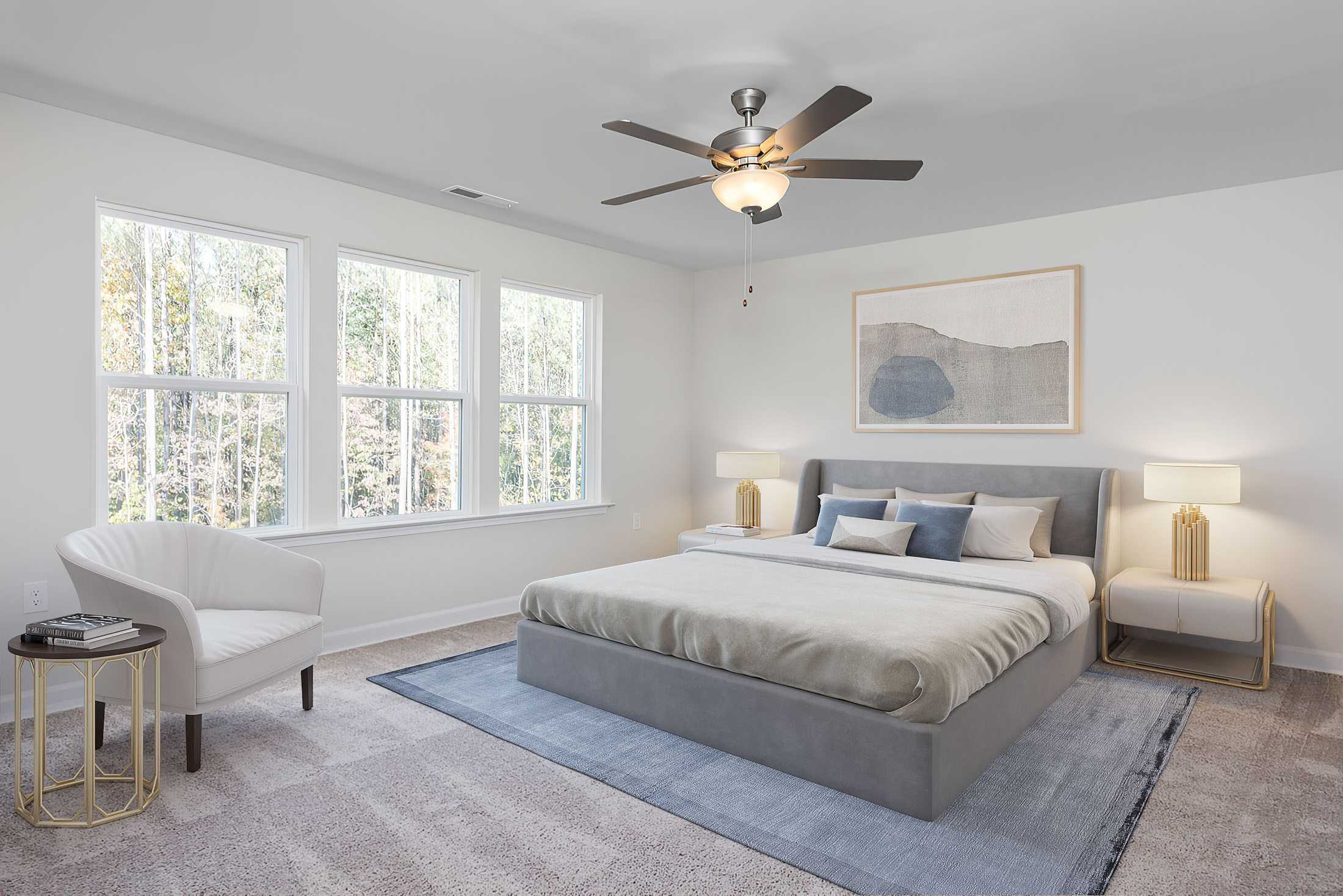 Spacious bedroom at Stagecoach Corner in Mebane NC with large windows, king bed, ceiling fan, and modern gray accents