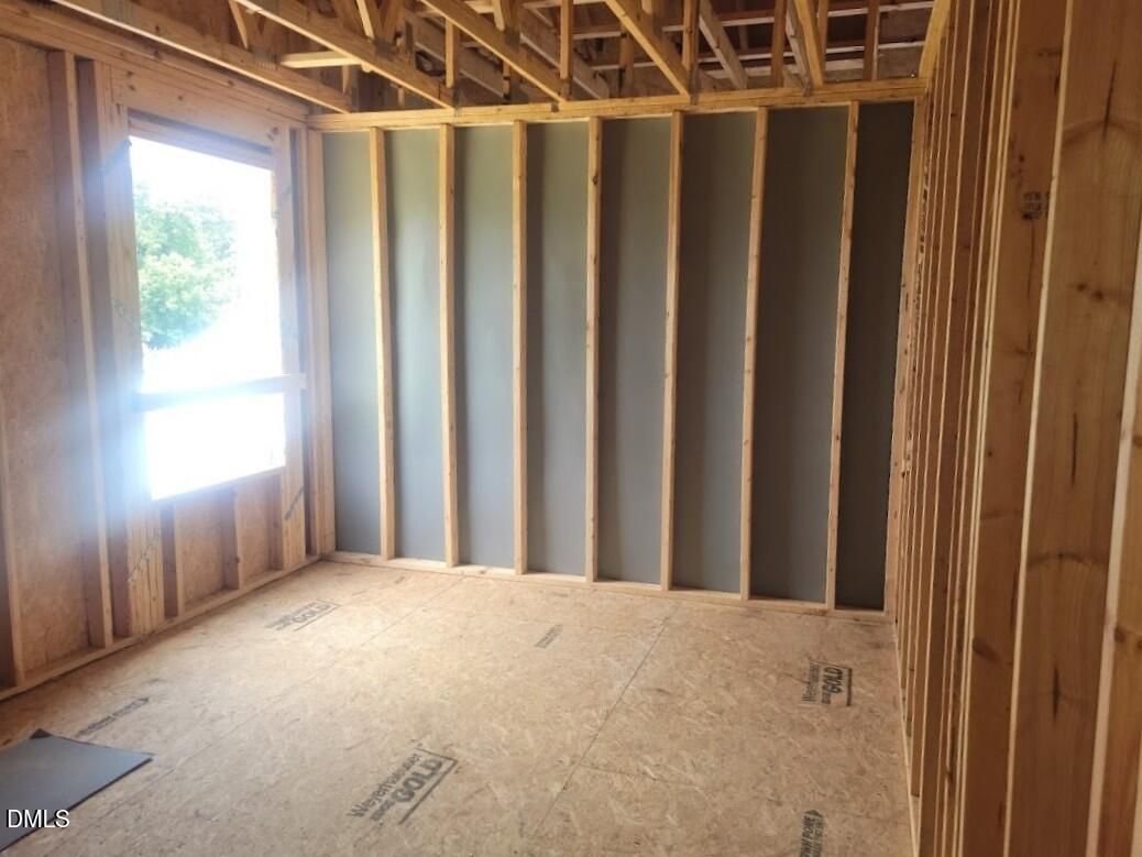 Framing and subfloor of a new construction bedroom in The Birch II A floor plan by Davidson Homes in Angier, NC.