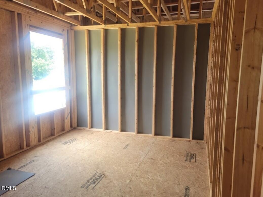 Interior framing of a bedroom under construction in The Birch II A floor plan by Davidson Homes, Angier, North Carolina.
