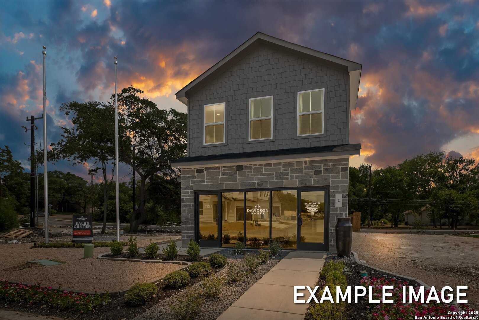 Modern 2-story Gillian C home with stone base and large windows by Davidson Homes in Meadows at Oak Creek, San Antonio, TX