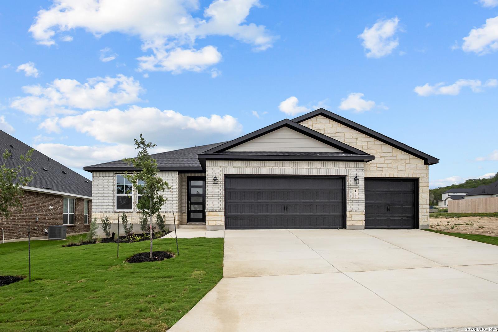 Single-story Lanier G floor plan by Davidson Homes with 2-car garage in The Reserve at Potranco Oaks, Castroville, Texas.