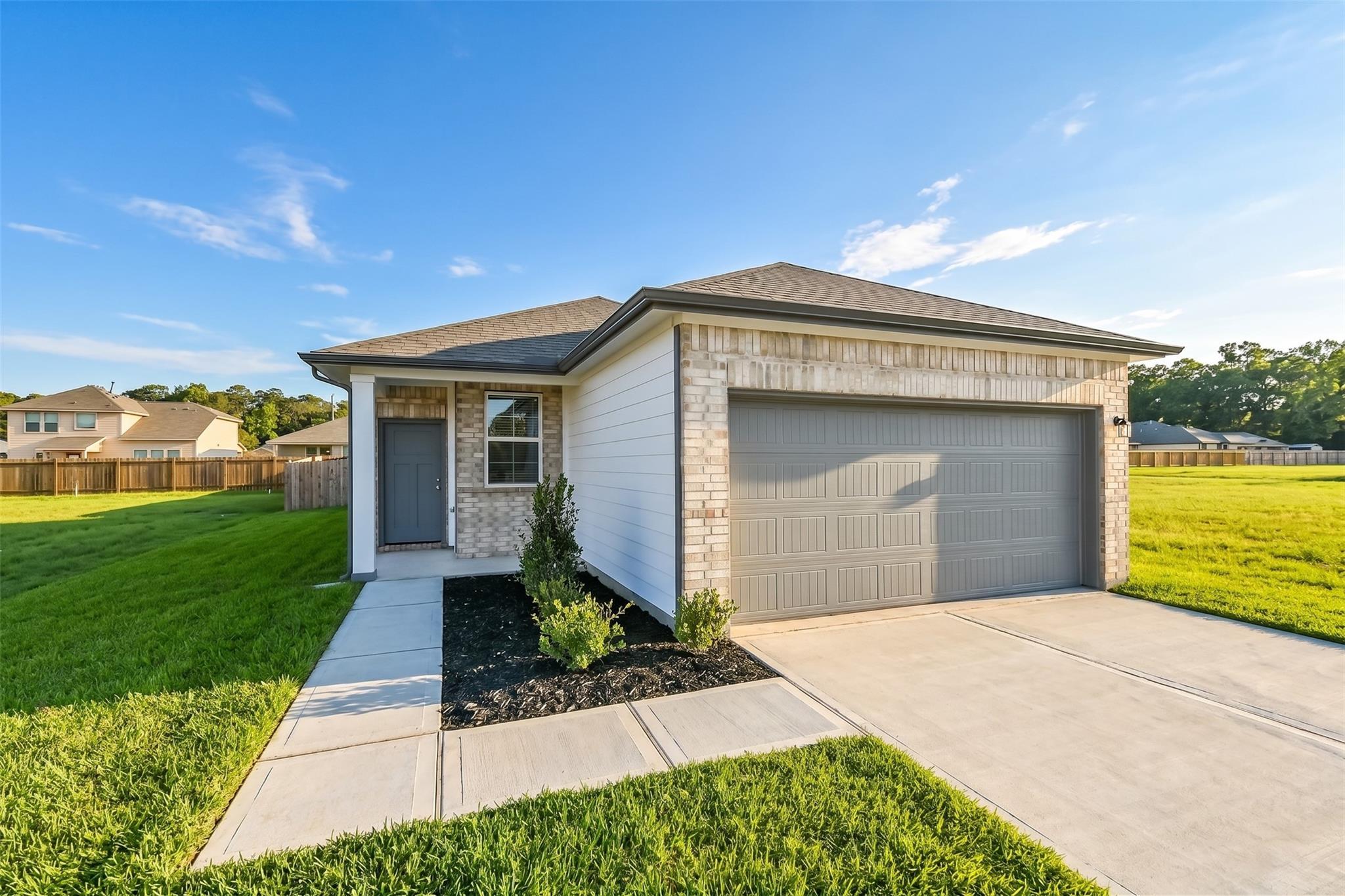 Single-story Colorado F floor plan by Davidson Homes with a 2-car garage in Liberty Estates, Cleveland, Texas.