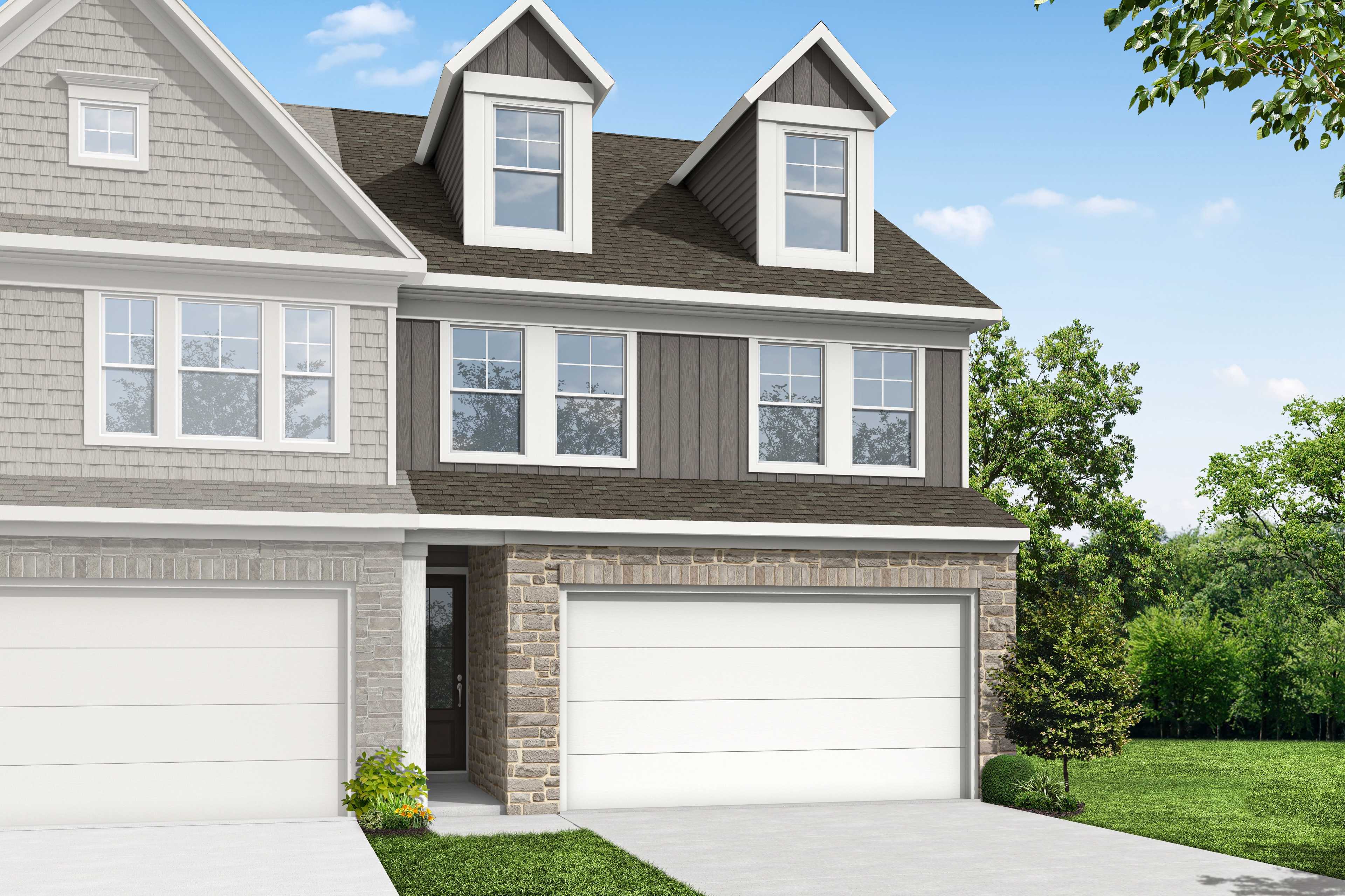 Two-story multi-family home elevation of The Wake G featuring stone accents, siding exterior, and two-car garage in Cumming GA