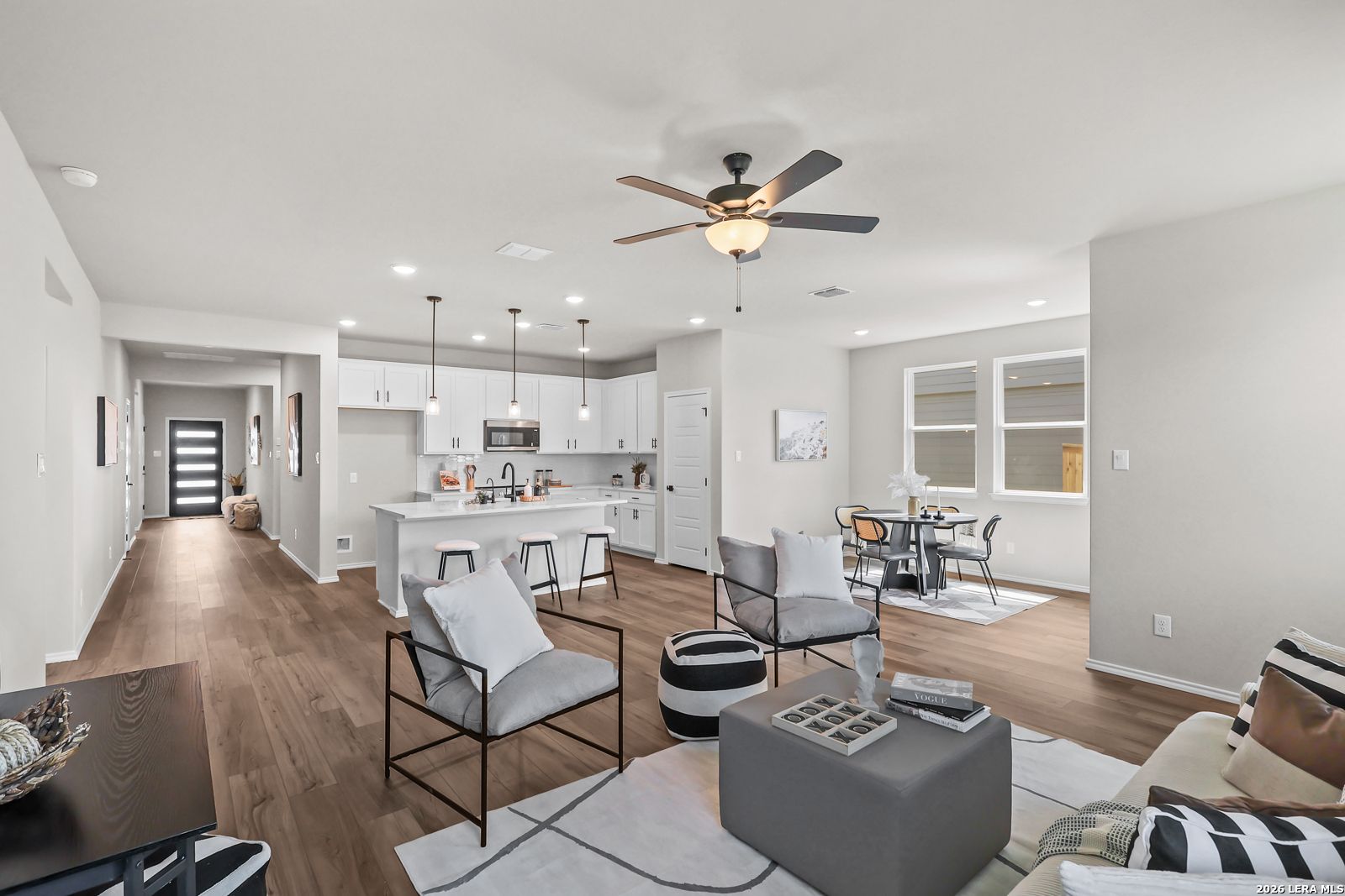 Open-concept living room and kitchen in The Daphne H floor plan by Davidson Homes in Hannah Heights, Seguin, Texas.