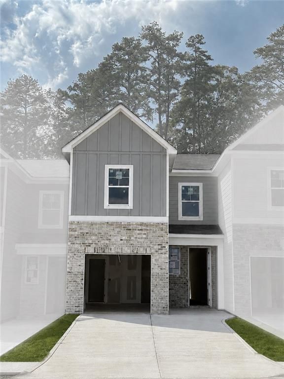 Two-story gray siding and brick exterior with 1-car garage at The Wilmington B by Davidson Homes in Stegall Village, Emerson, GA