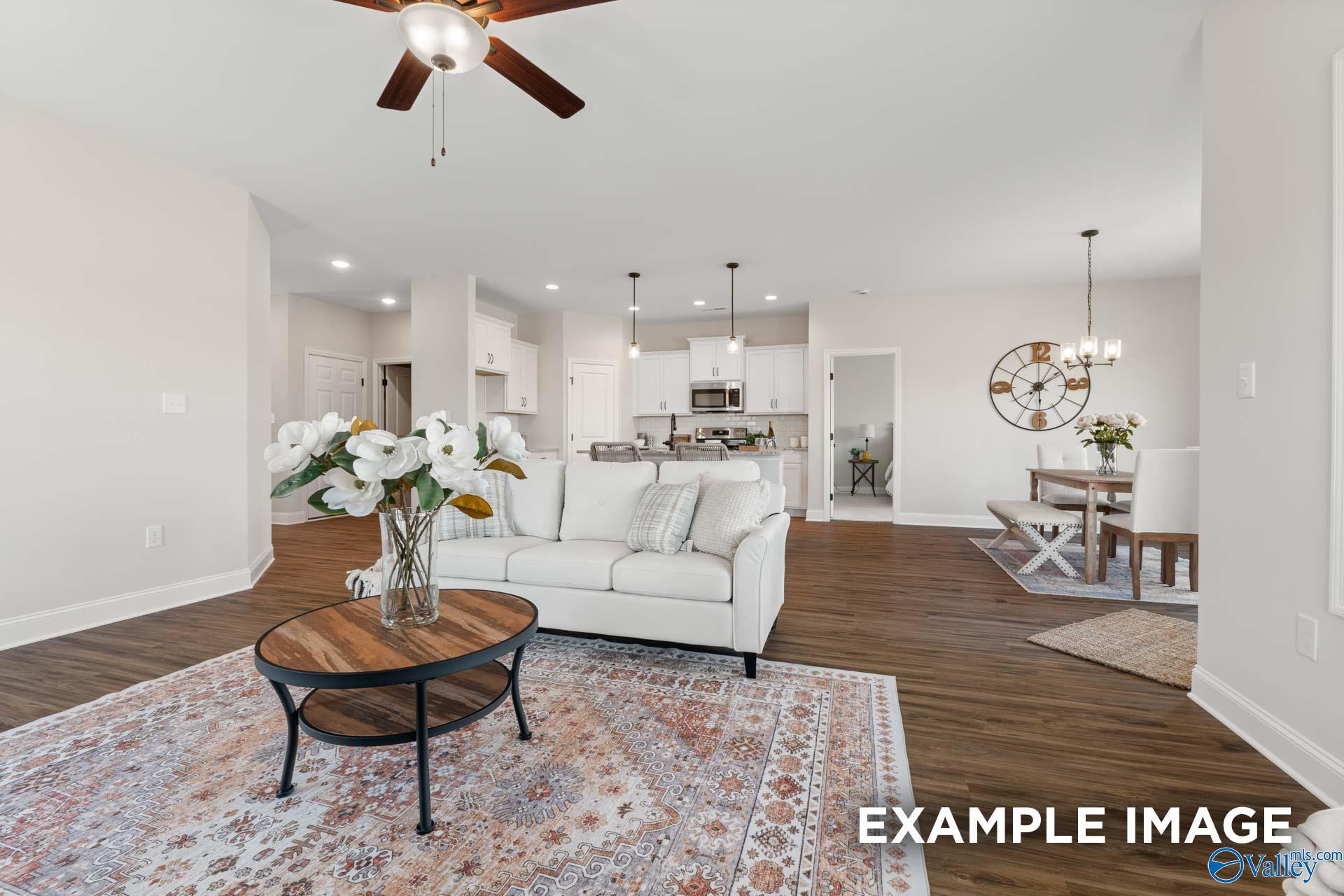 Open-concept living room and dining area in The Franklin C floor plan by Davidson Homes in Jaguar Hills, Huntsville, AL.