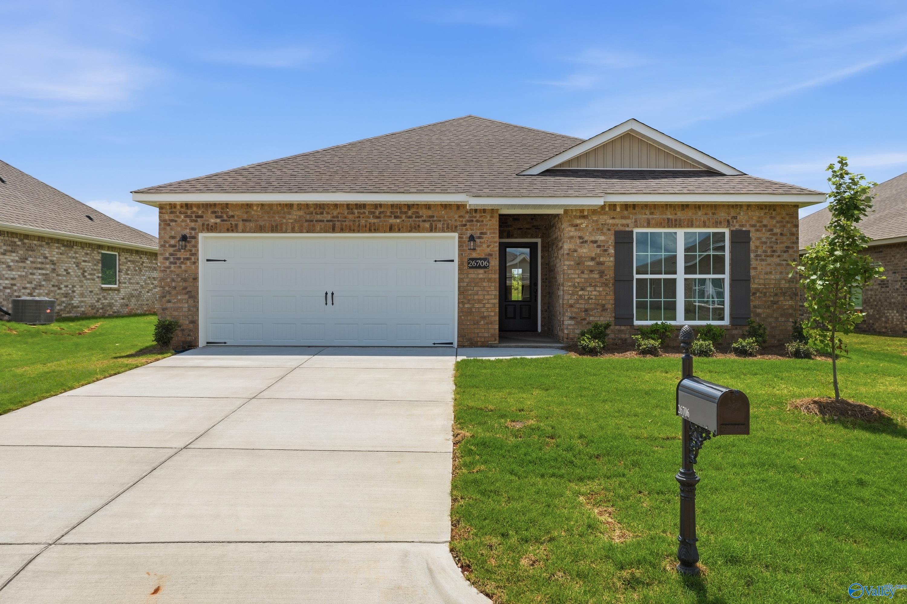 Single-story brick home with 2-car garage, The Franklin floor plan by Davidson Homes in Ricketts Farm, Athens, Alabama.