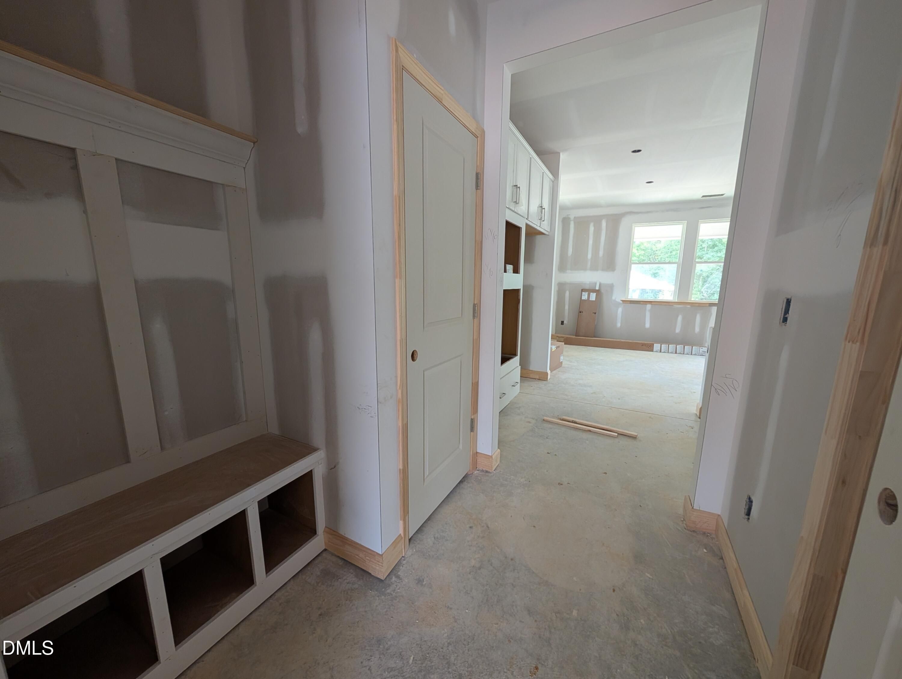 Mudroom with built-in bench and cubby storage under construction in Davidson Homes The Beech floor plan, Wendell Ridge, NC