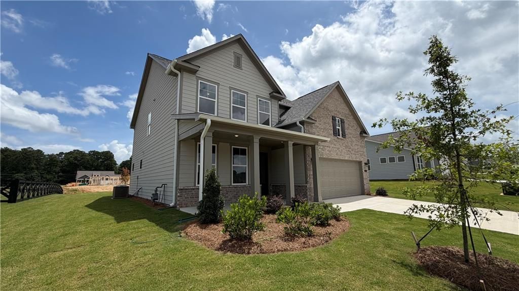 Two-story Hickory C floor plan by Davidson Homes with 2-car garage in Wehunt Meadows, Hoschton, Georgia.