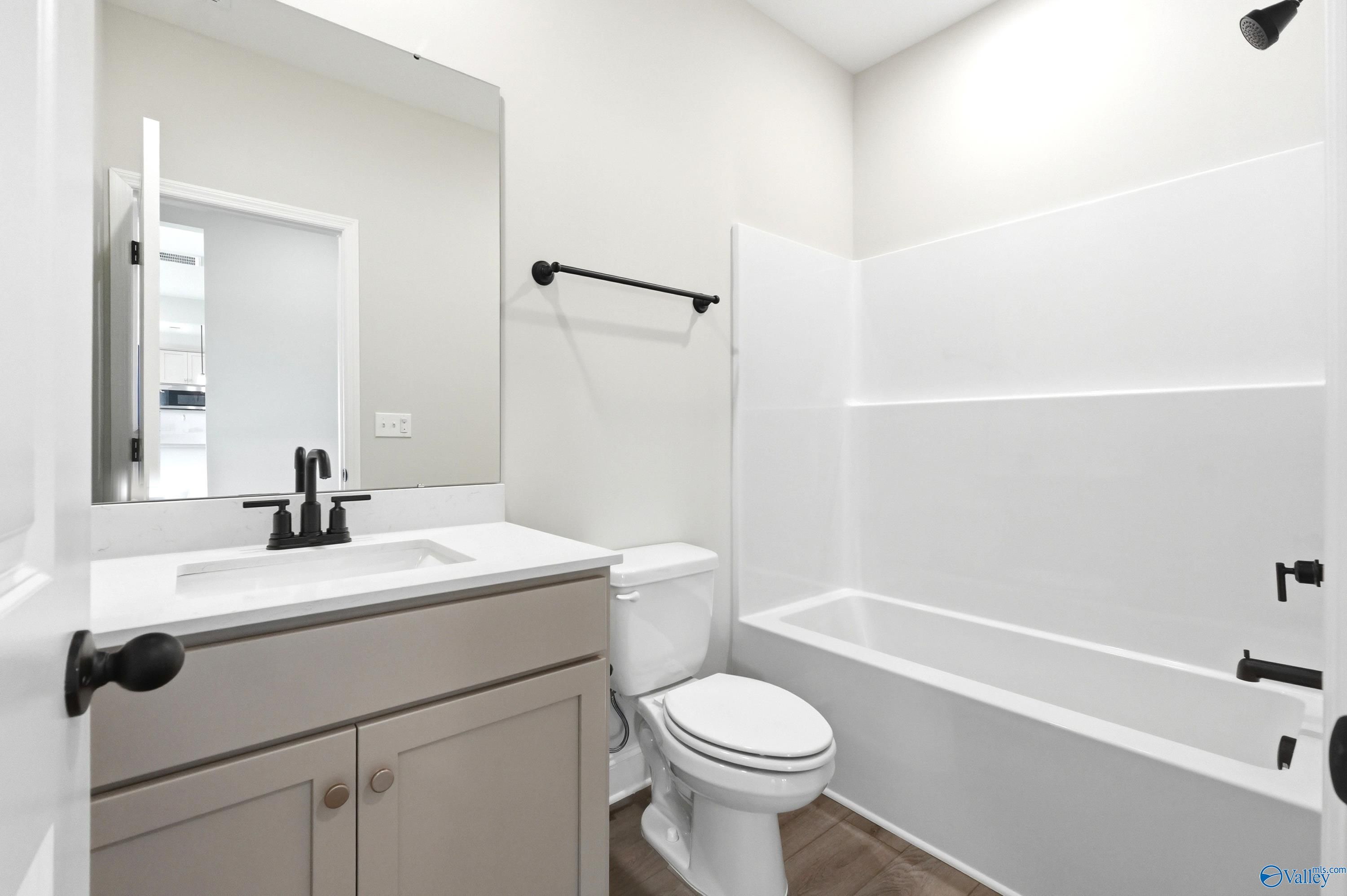 Modern bathroom with vanity and tub-shower combo in The Shelby A floor plan, Clearview, Hazel Green, Alabama.