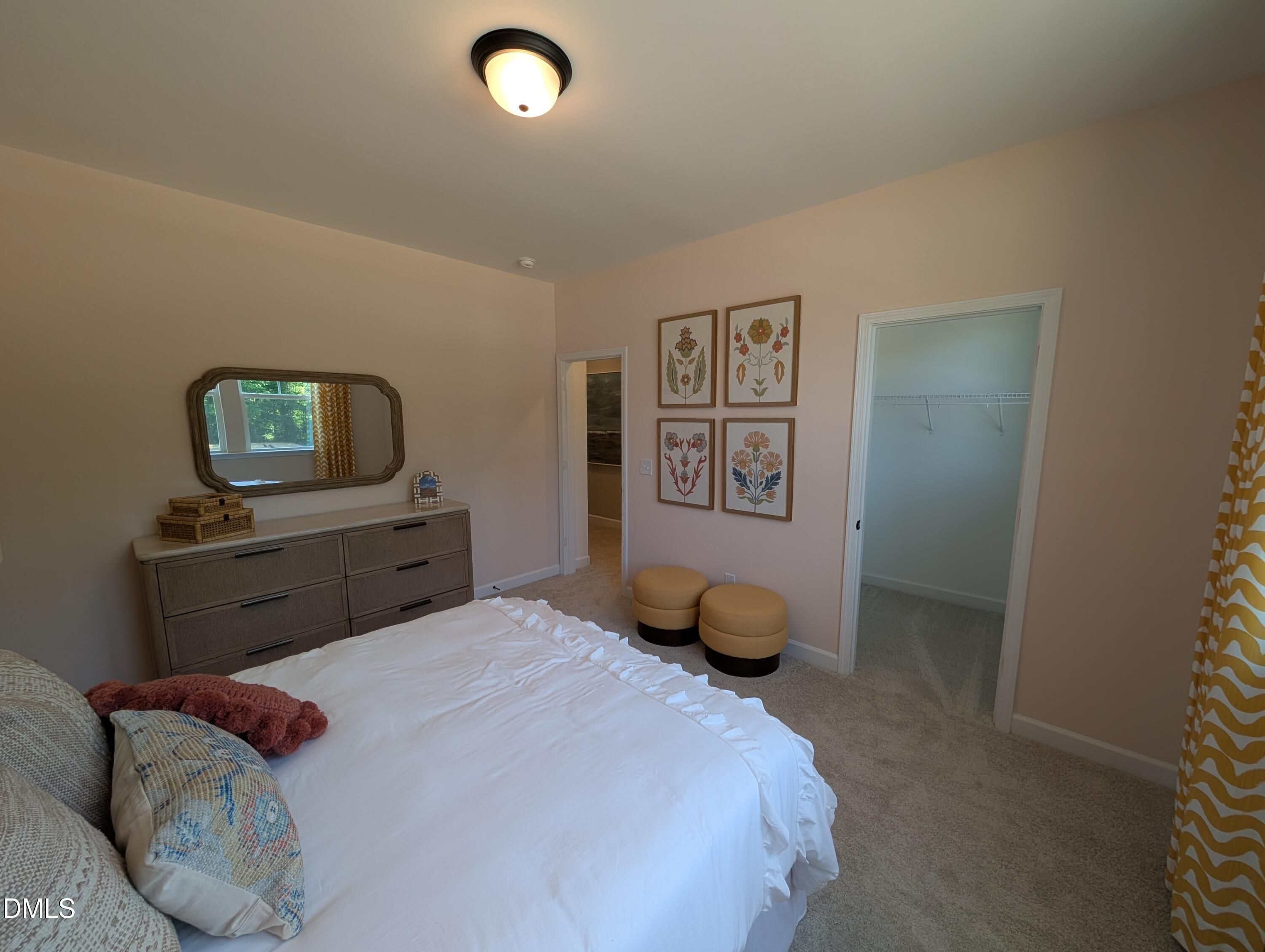 Cozy bedroom with walk-in closet in The Aspen B floor plan by Davidson Homes at Wendell Ridge, Wendell, North Carolina.
