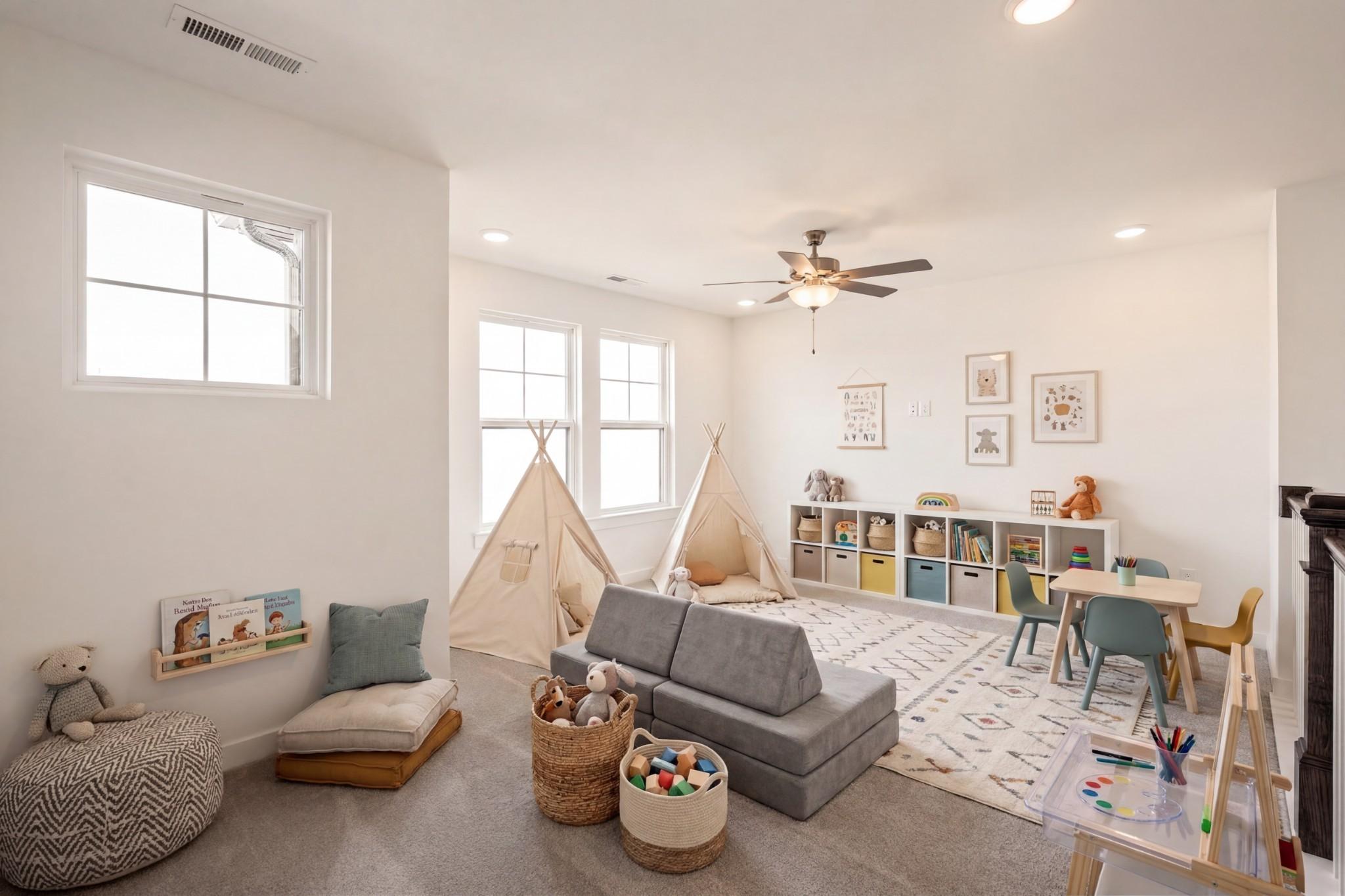 Bright, spacious playroom with play tents and storage in a Davidson Homes Willow D floor plan in Mt. Juliet, Tennessee.