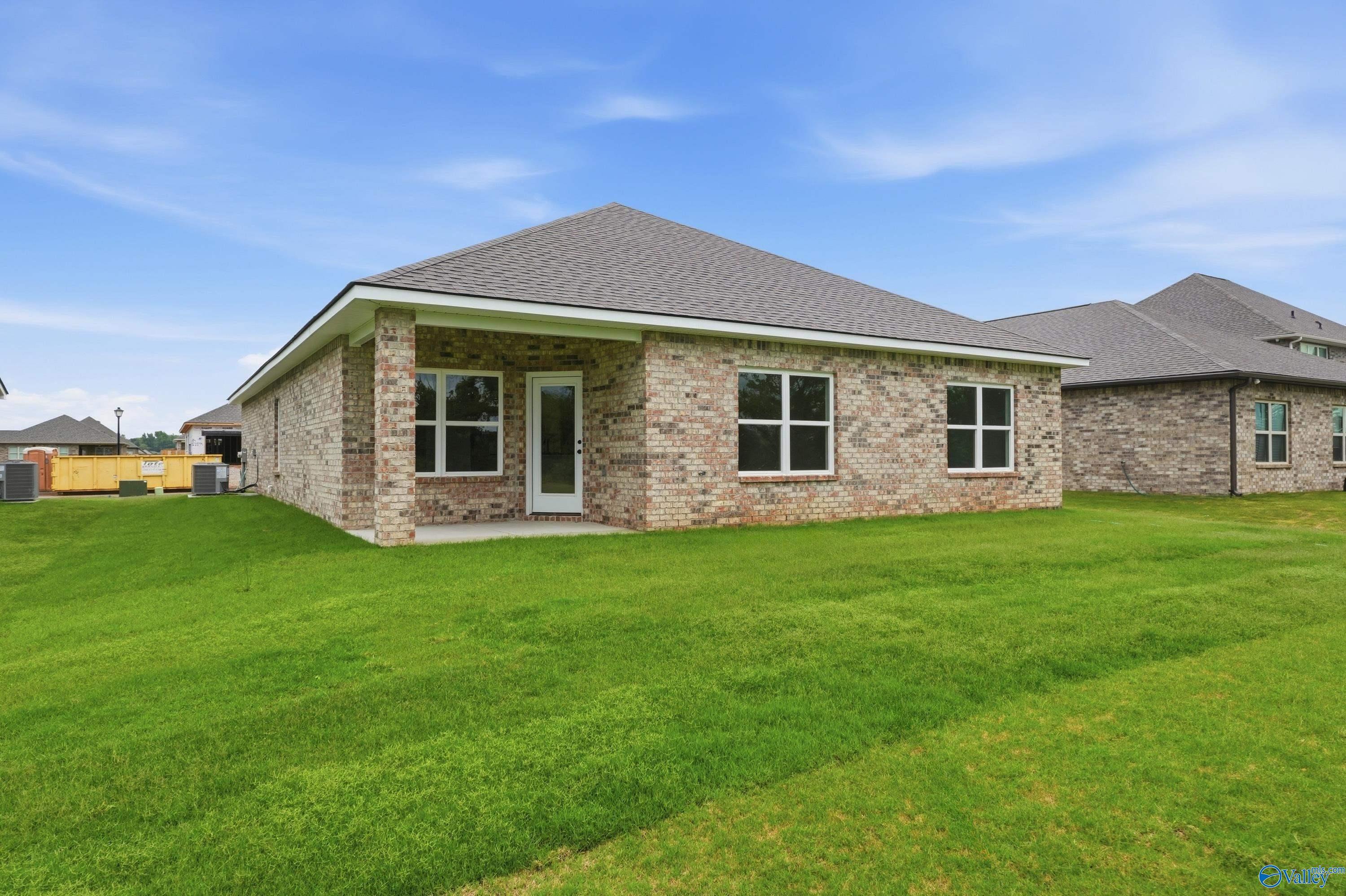 Exterior view of the back of a Daphne C floor plan home by Davidson Homes in Ivy Hills, Toney, Alabama.