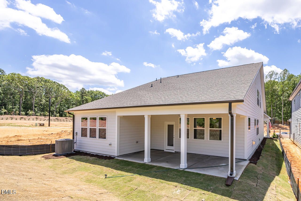 Covered back patio of The Birch II E floor plan by Davidson Homes in Sage on North Main, Wake Forest, North Carolina.