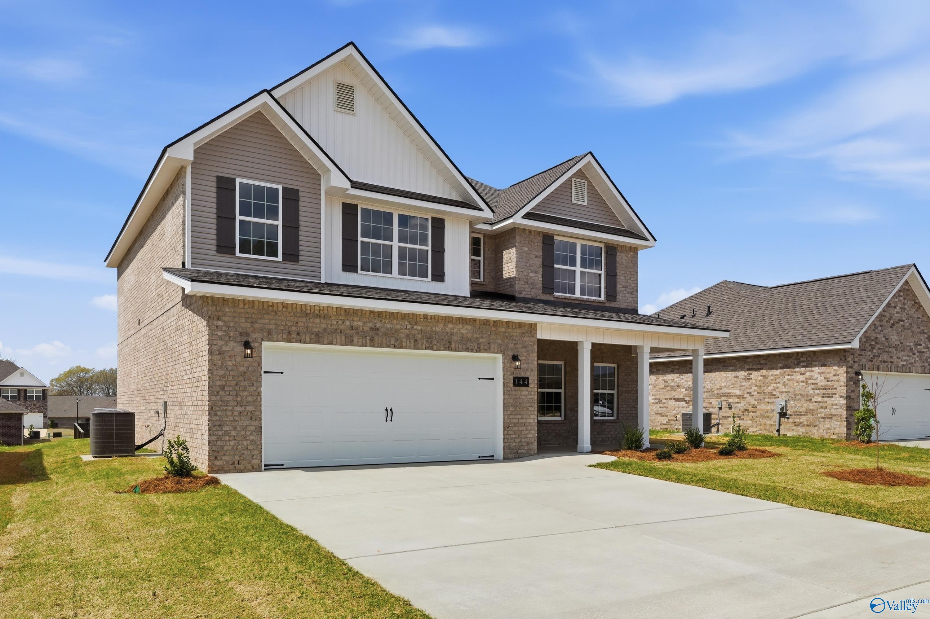 Two-story brick home with 2-car garage, front porch, and landscaping in Creek Grove, New Market, Alabama - Davidson Homes Shelby B