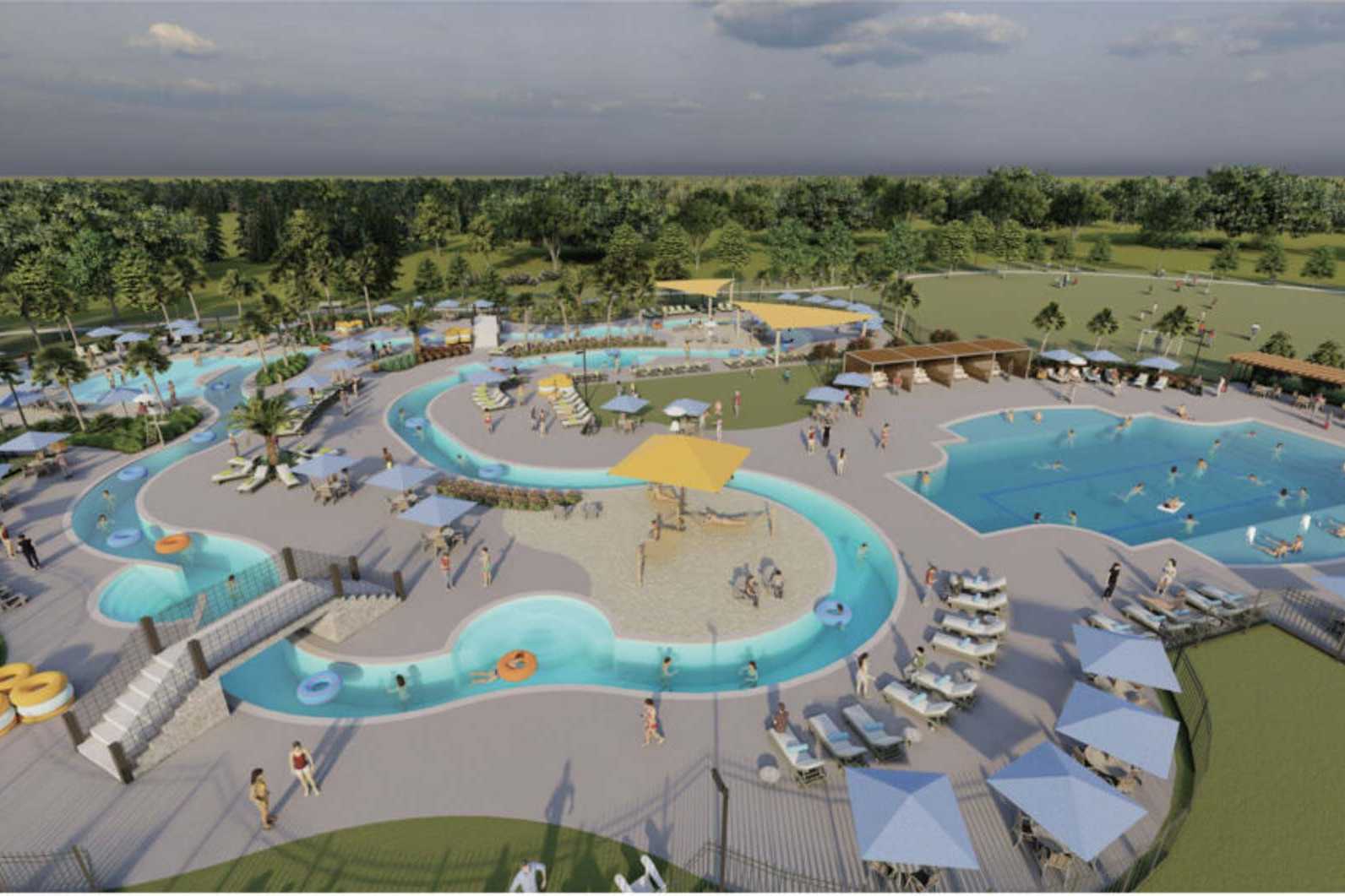 Resort-style lazy river pool at Sierra Vista in Rosharon TX with slides, cabanas, umbrellas and lounge seating