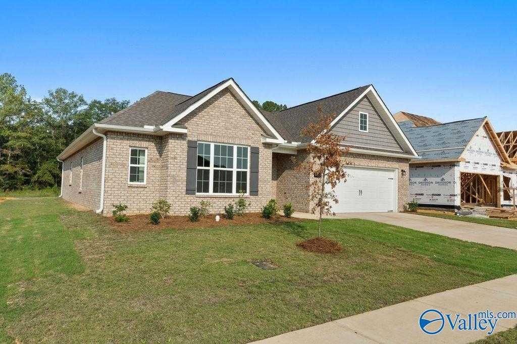 Modern brick 1-story home with 2-car garage, gabled roof, and landscaped yard in Cain Park, Hartselle, Alabama - Davidson Homes Montgomery B