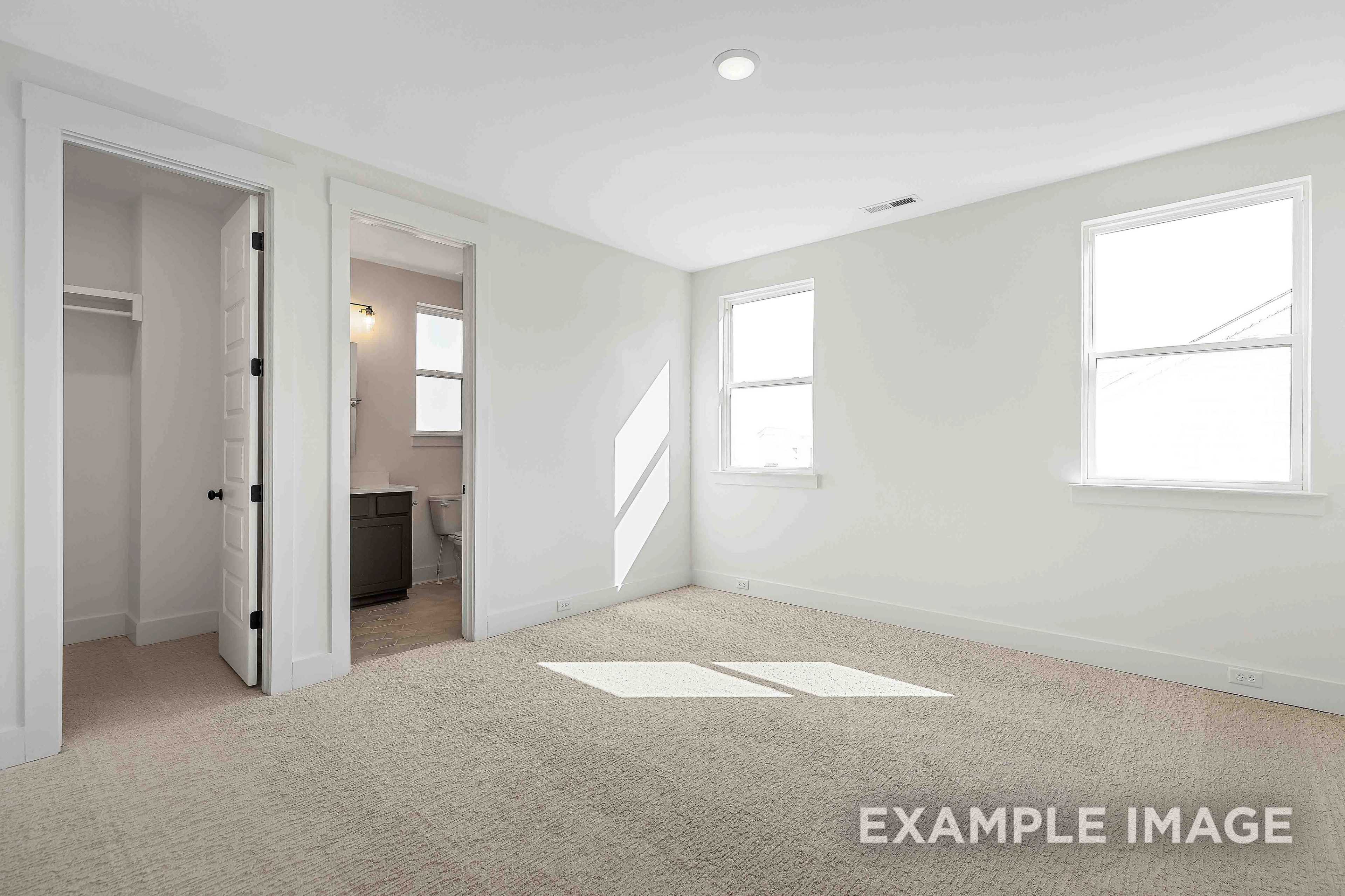 Spacious master bedroom in The Albany A with en-suite bath, walk-in closet, and sunlit windows in Murfreesboro home