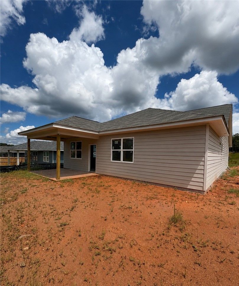 Exterior view of The Aurora D floor plan featuring a covered back patio at Anderson Lakes in Opelika, Alabama.