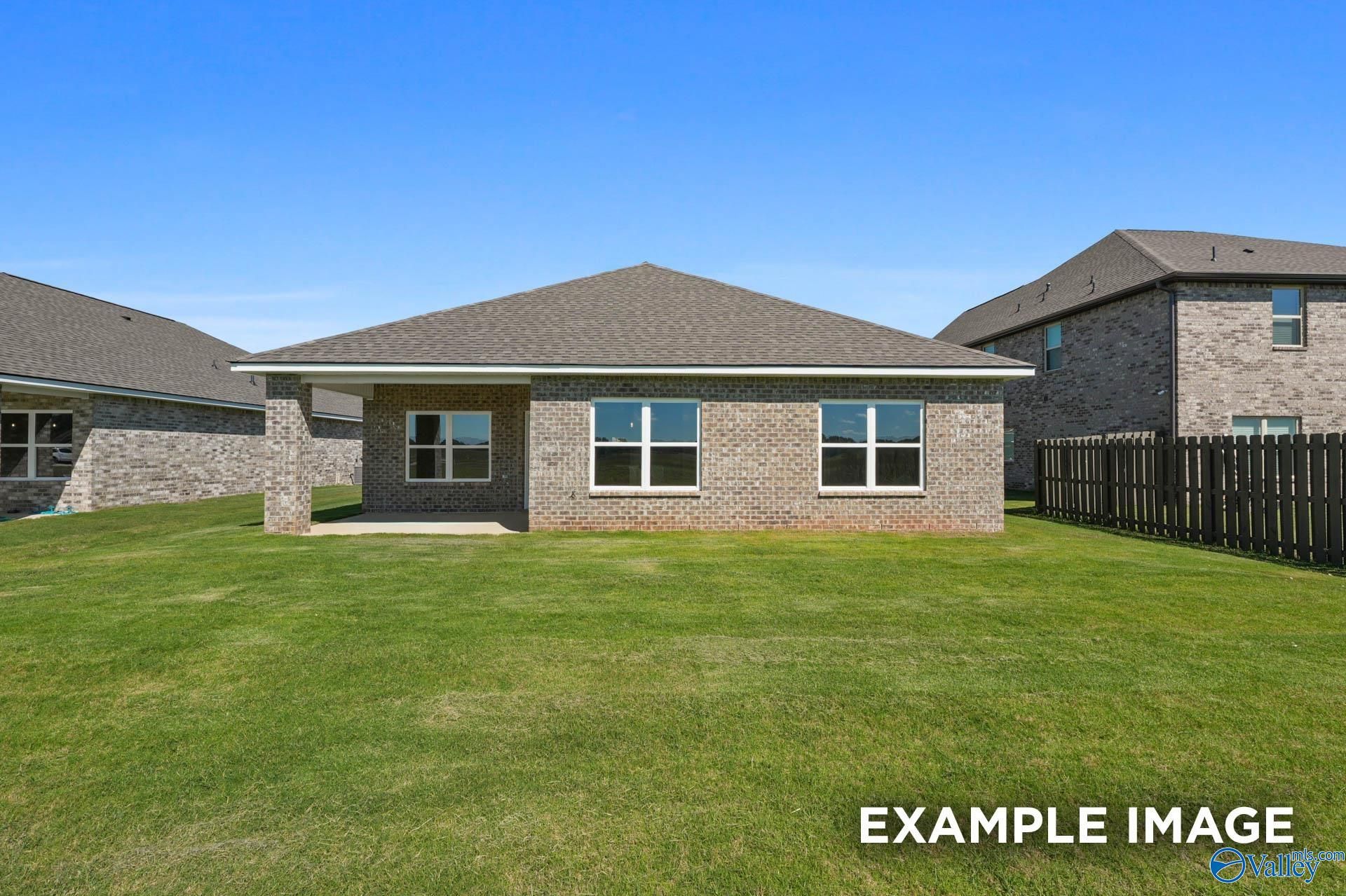 Brick exterior of The Everett B floor plan by Davidson Homes with a covered back patio in The Meadows, Athens, Alabama.
