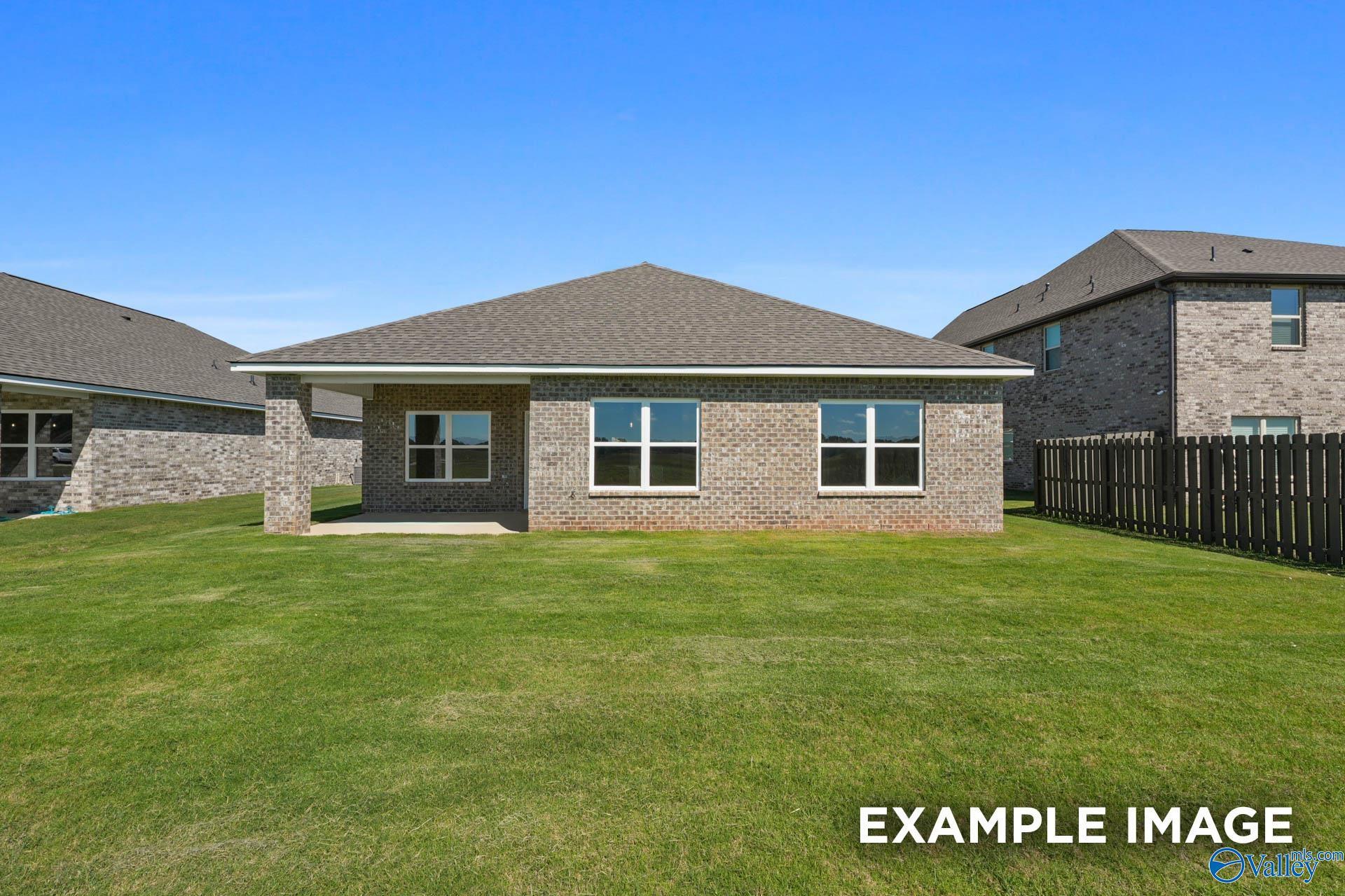 Brick exterior of The Everett B floor plan by Davidson Homes with a covered back patio in The Meadows, Athens, Alabama.