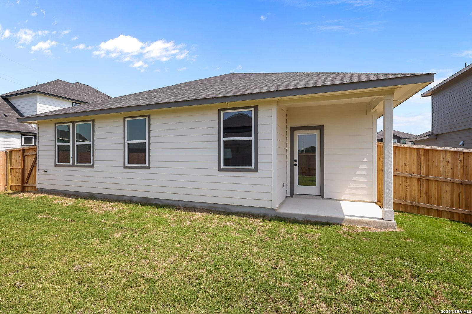 Covered back patio and private backyard of The Daphne H floor plan by Davidson Homes in Hannah Heights, Seguin, Texas.