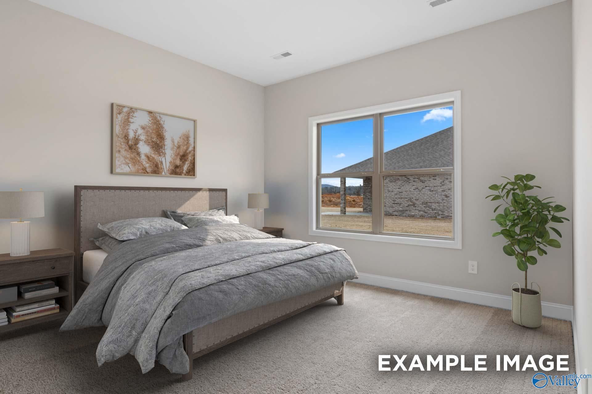 Serene bedroom with king bed, neutral walls, potted plant, and window view of barn in Davidson Homes Everett, Meridianville, AL