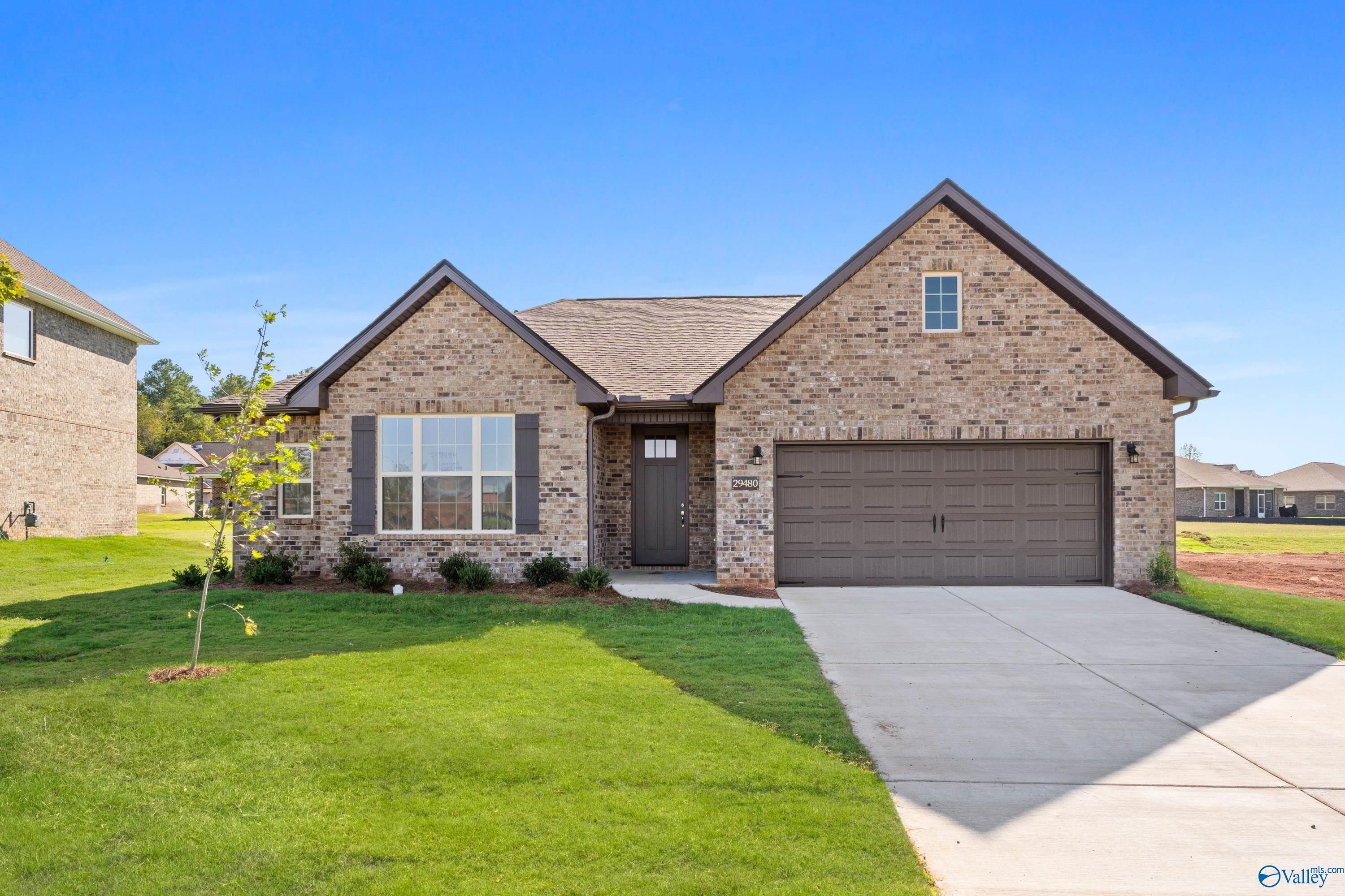 The Montgomery B floor plan by Davidson Homes in The Meadows, Athens, Alabama, featuring a 1-story brick exterior.