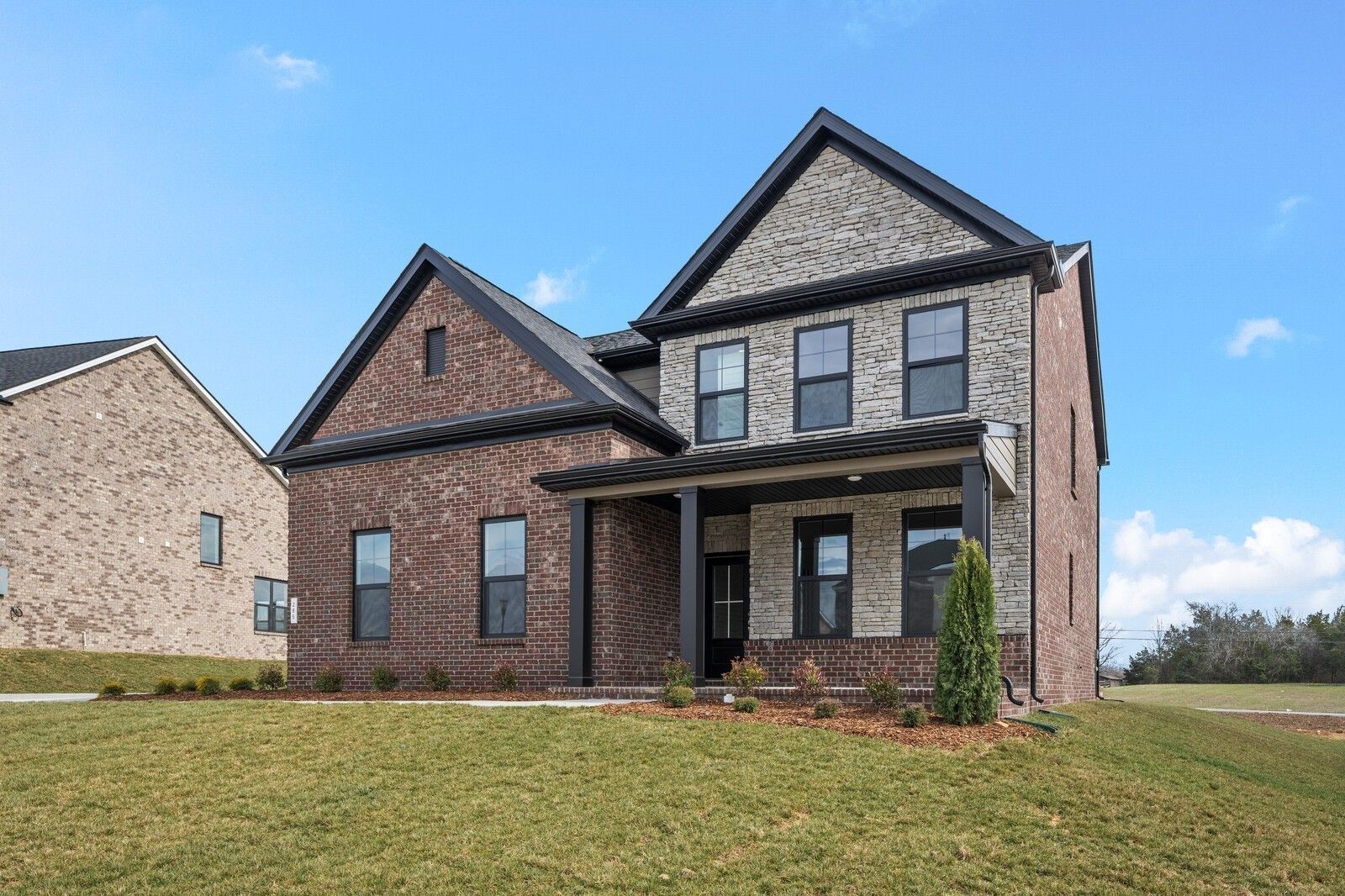 Two-story brick and stone home, The Henry C floor plan by Davidson Homes in Benders Cove, Mt. Juliet, Tennessee.