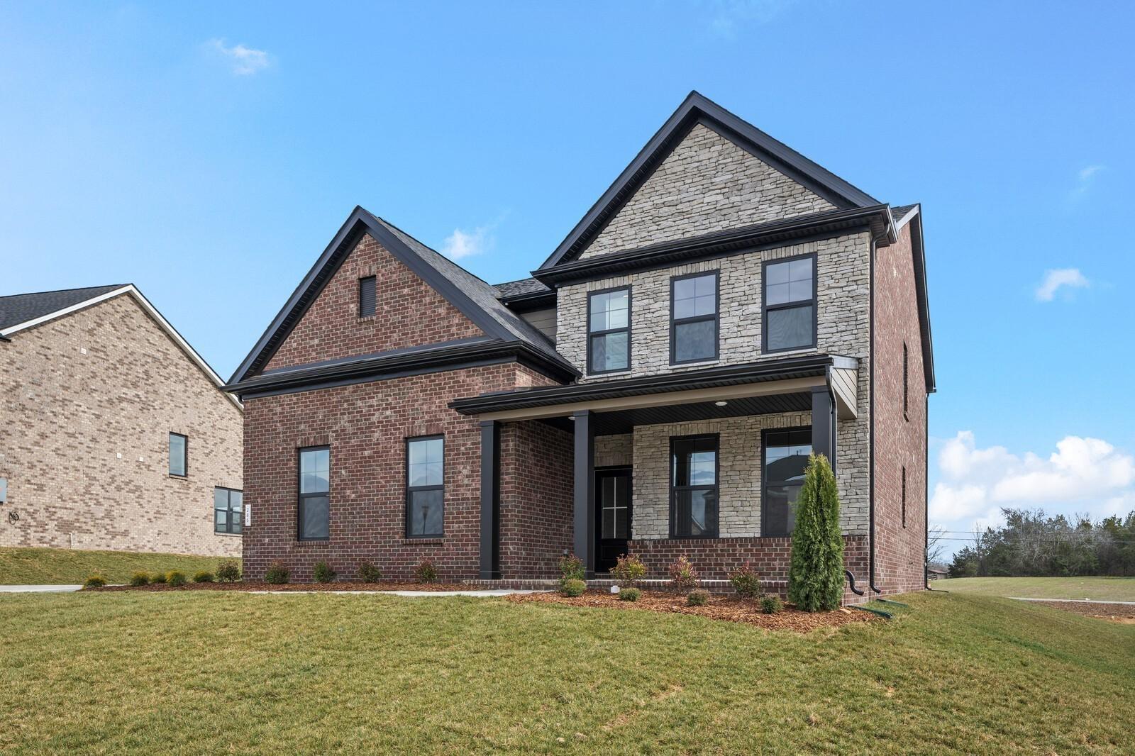 Two-story brick and stone home, The Henry C floor plan by Davidson Homes in Benders Cove, Mt. Juliet, Tennessee.