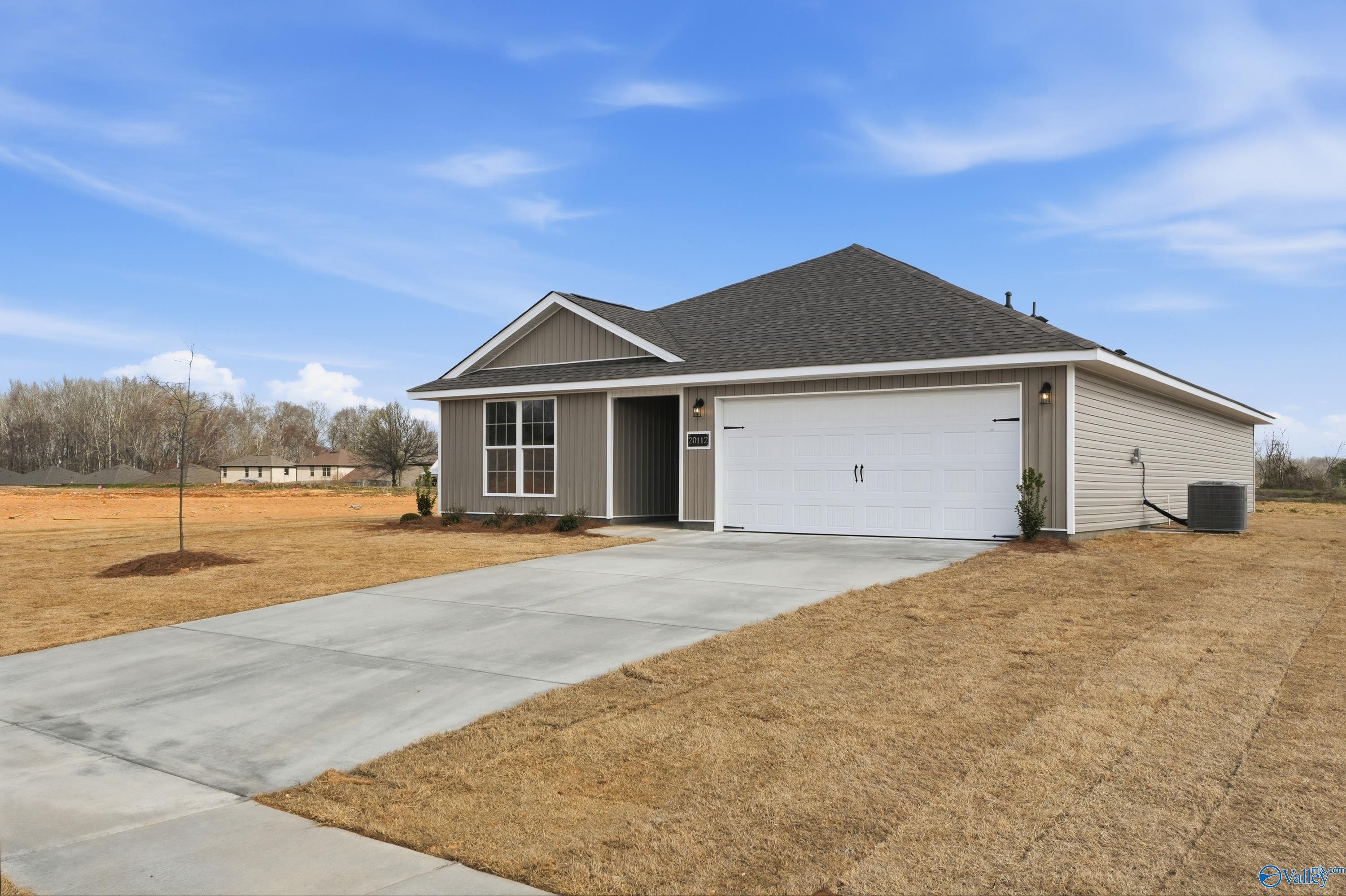 Exterior of The Franklin V 1-story home by Davidson Homes in Chapel Hill, Athens, Alabama, with 2-car garage and concrete driveway