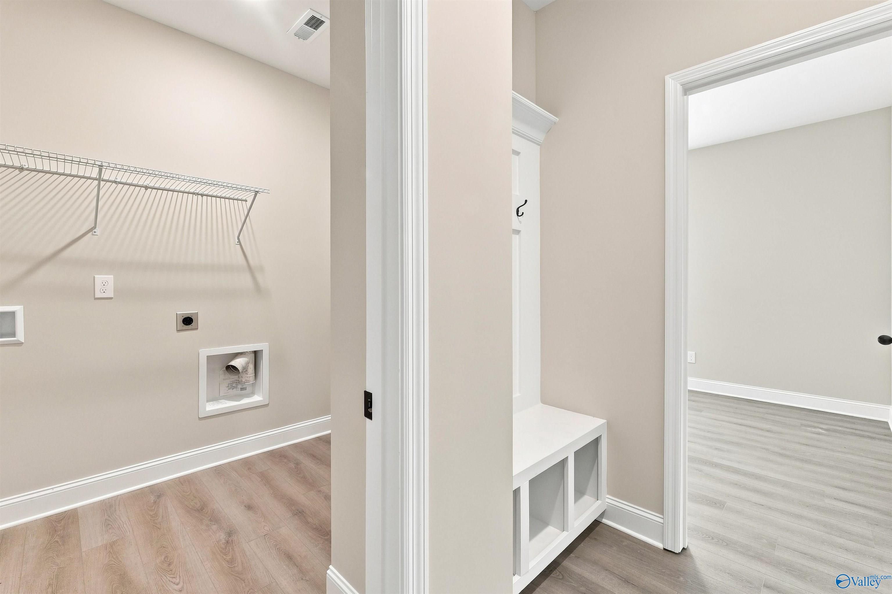 Laundry room and mudroom bench in The Daphne floor plan by Davidson Homes at Spragins Cove in Huntsville, Alabama.