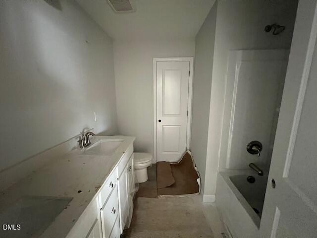 Spacious bathroom featuring double vanity, bathtub, shower, and toilet in Davidson Homes The Adalynn B, Lillington, NC