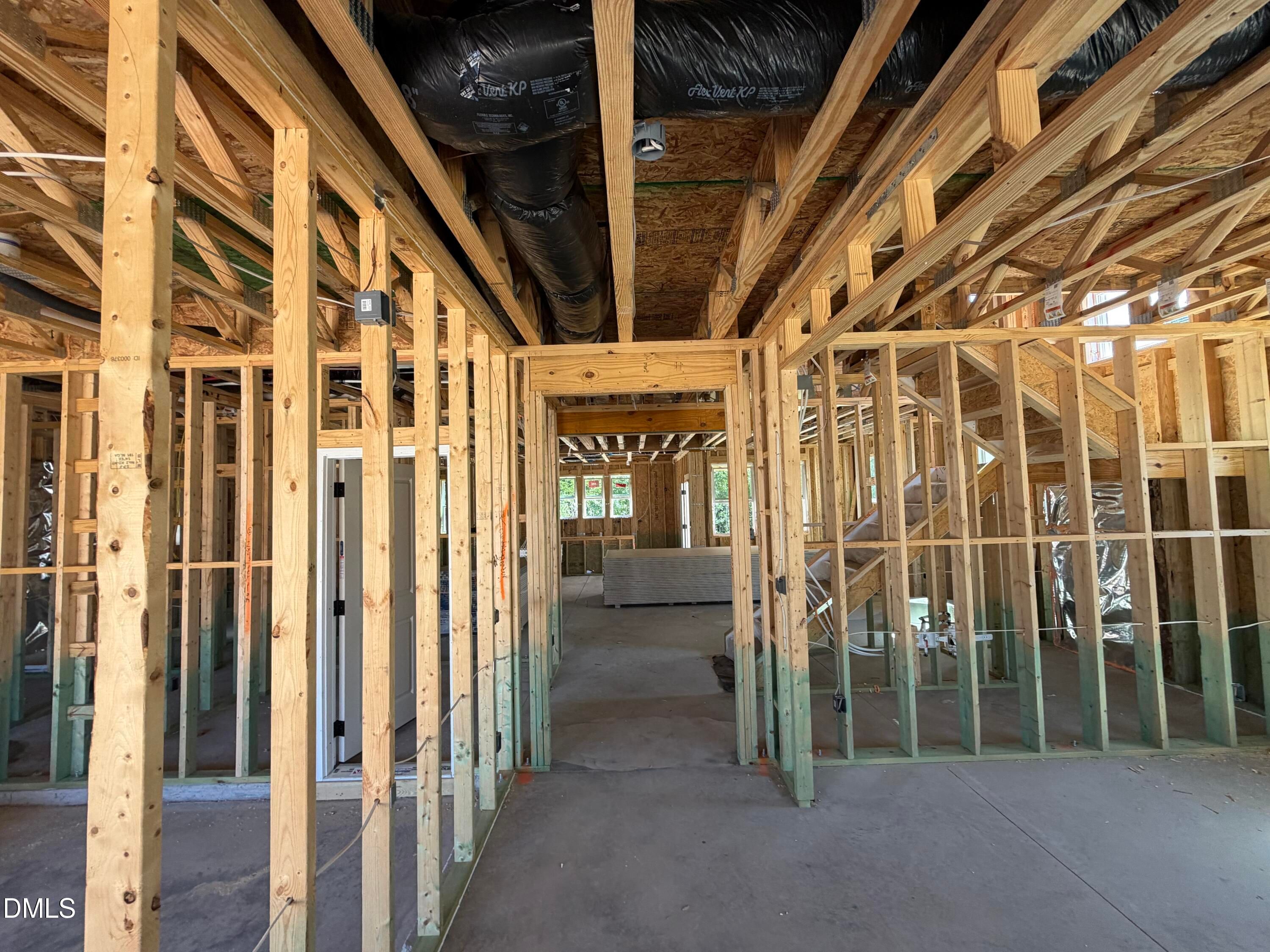 Unfinished wood framing and exposed ductwork in new construction home, Davidson Homes The Aspen C, Wendell Ridge, NC