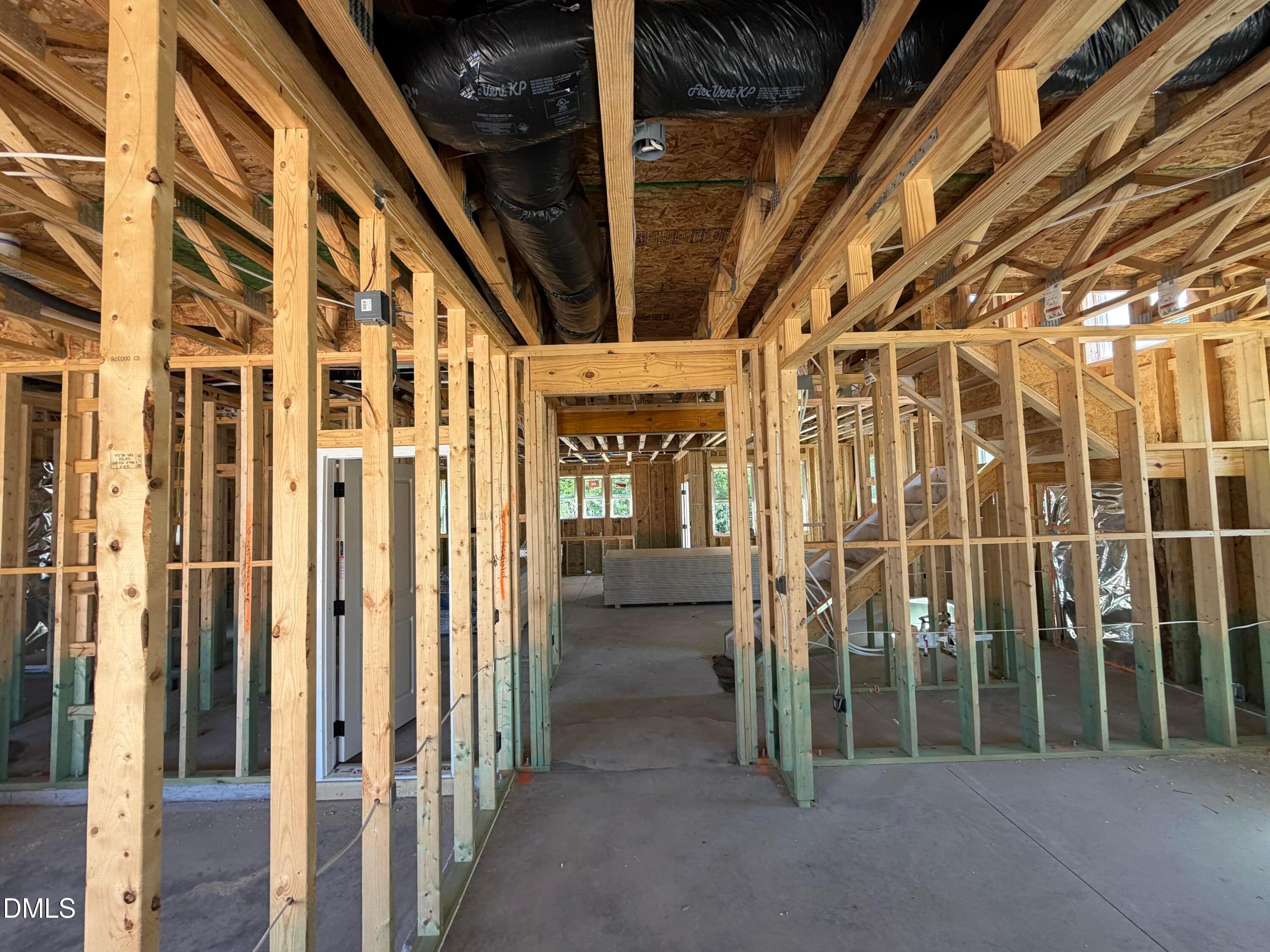 Unfinished wood framing and exposed ductwork in new construction home, Davidson Homes The Aspen C, Wendell Ridge, NC