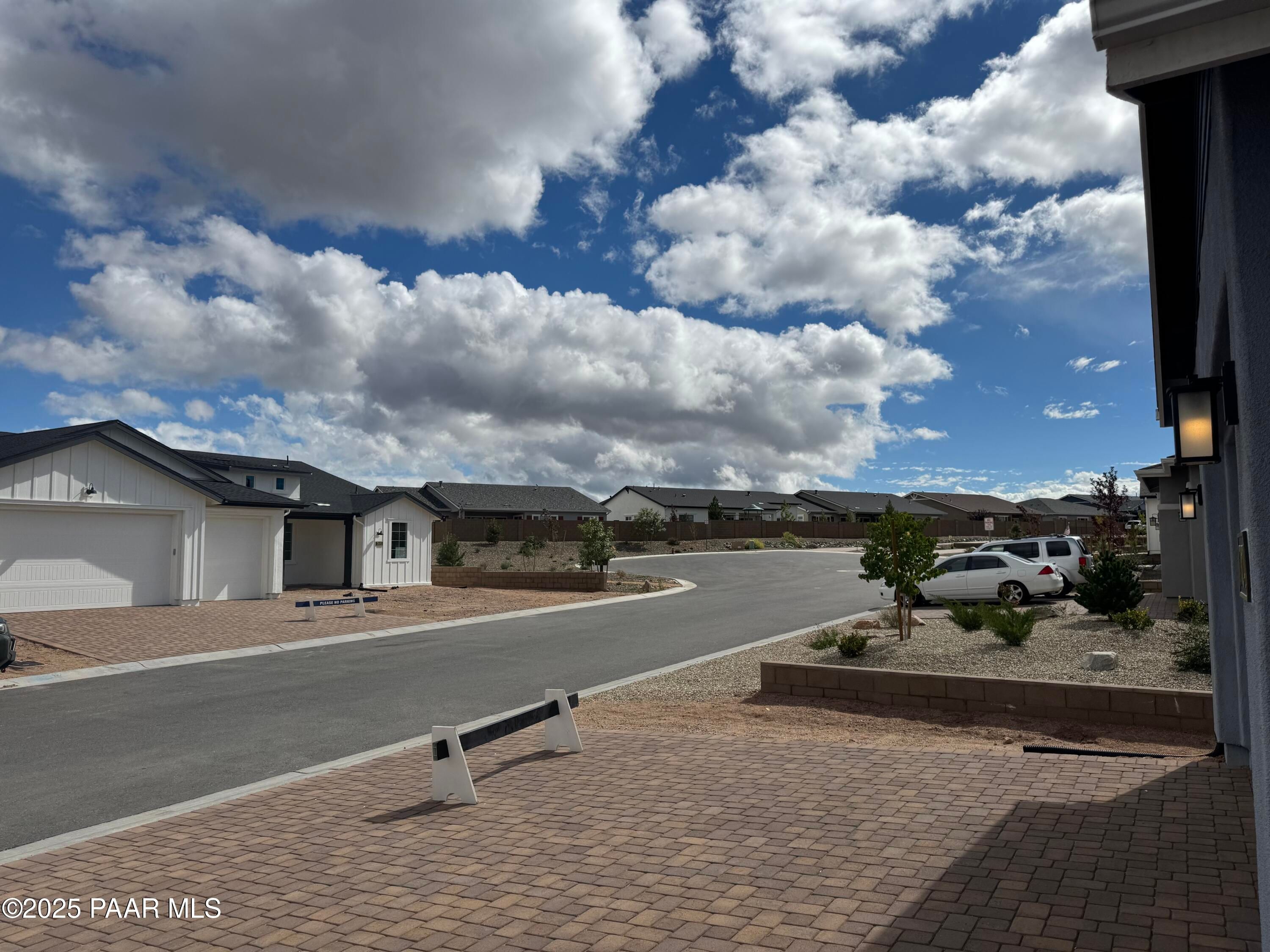 Modern single-story home with 3-car garage and paver driveway in Westwood, Prescott, Arizona desert neighborhood