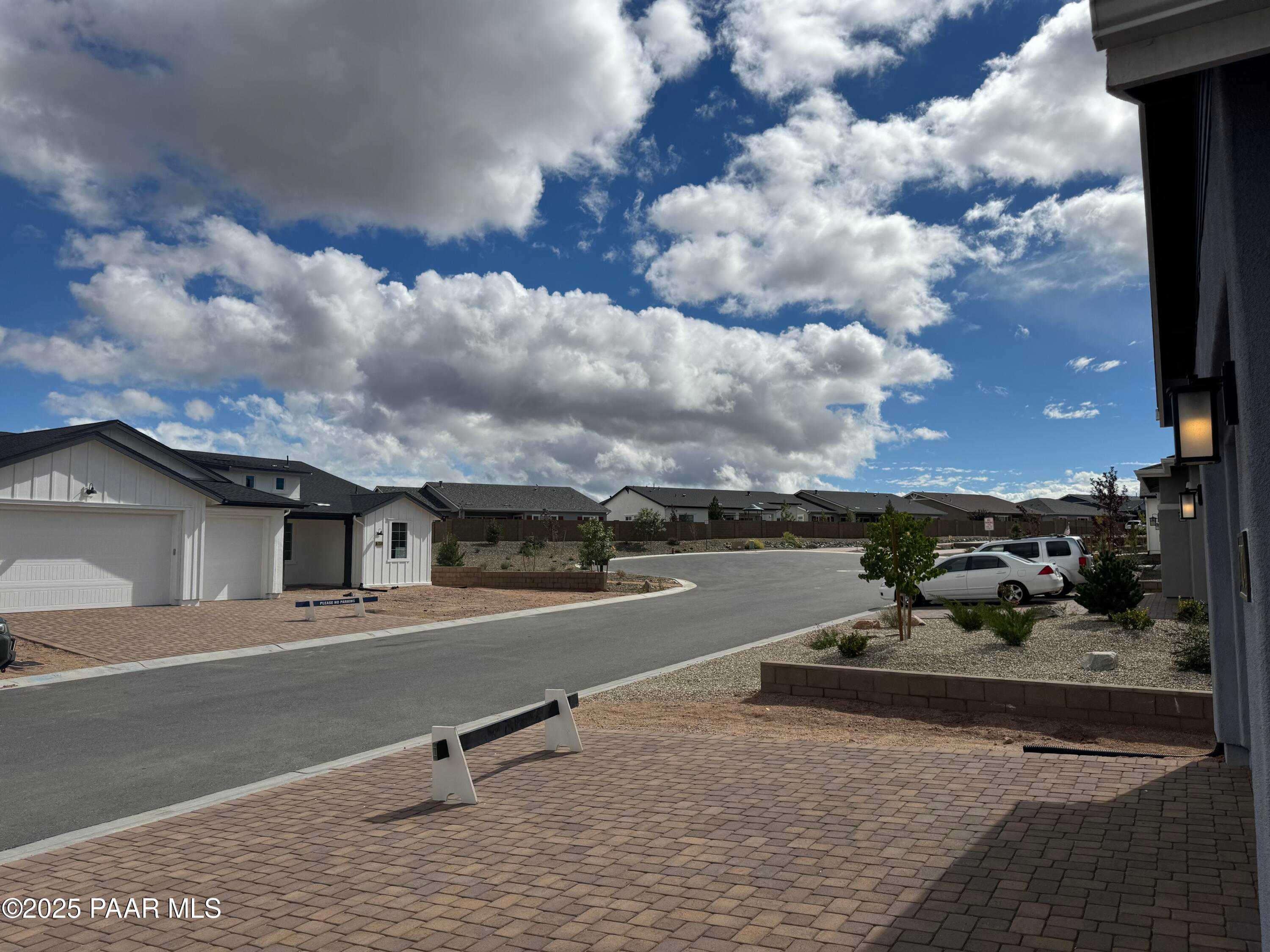 Modern single-story home with 3-car garage and paver driveway in Westwood, Prescott, Arizona desert neighborhood
